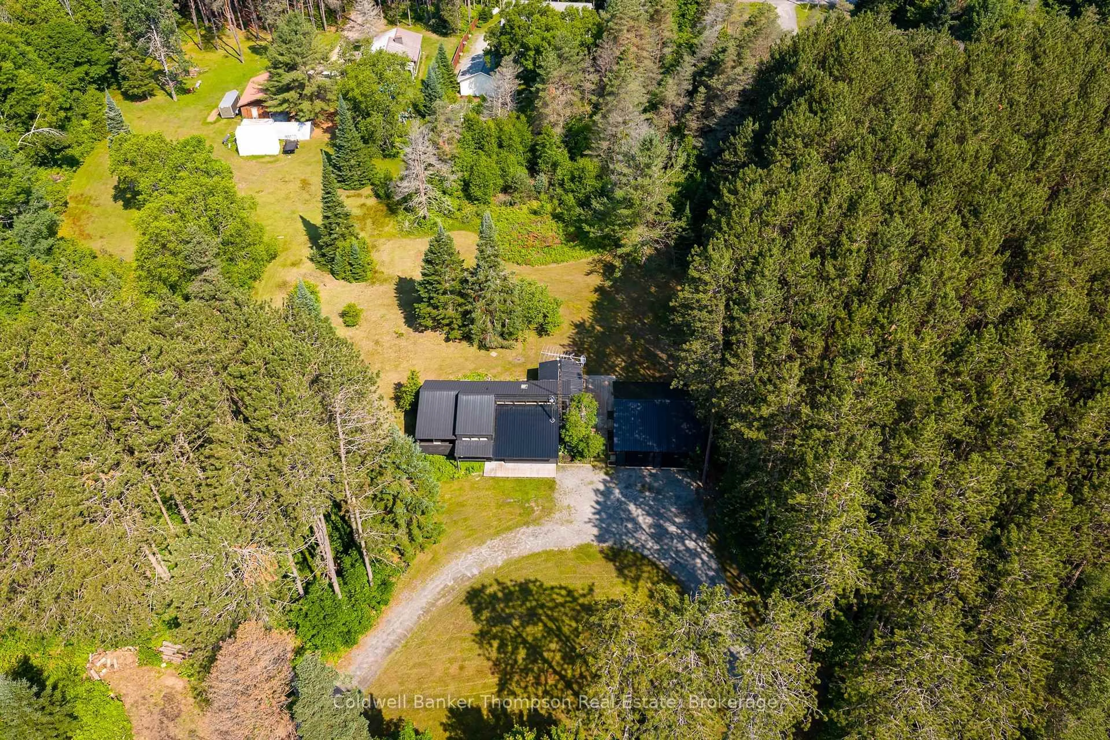 A pic from outside/outdoor area/front of a property/back of a property/a pic from drone, forest/trees view for 1049 Lawrence Pit Rd, Muskoka Lakes Ontario P0B 1M0