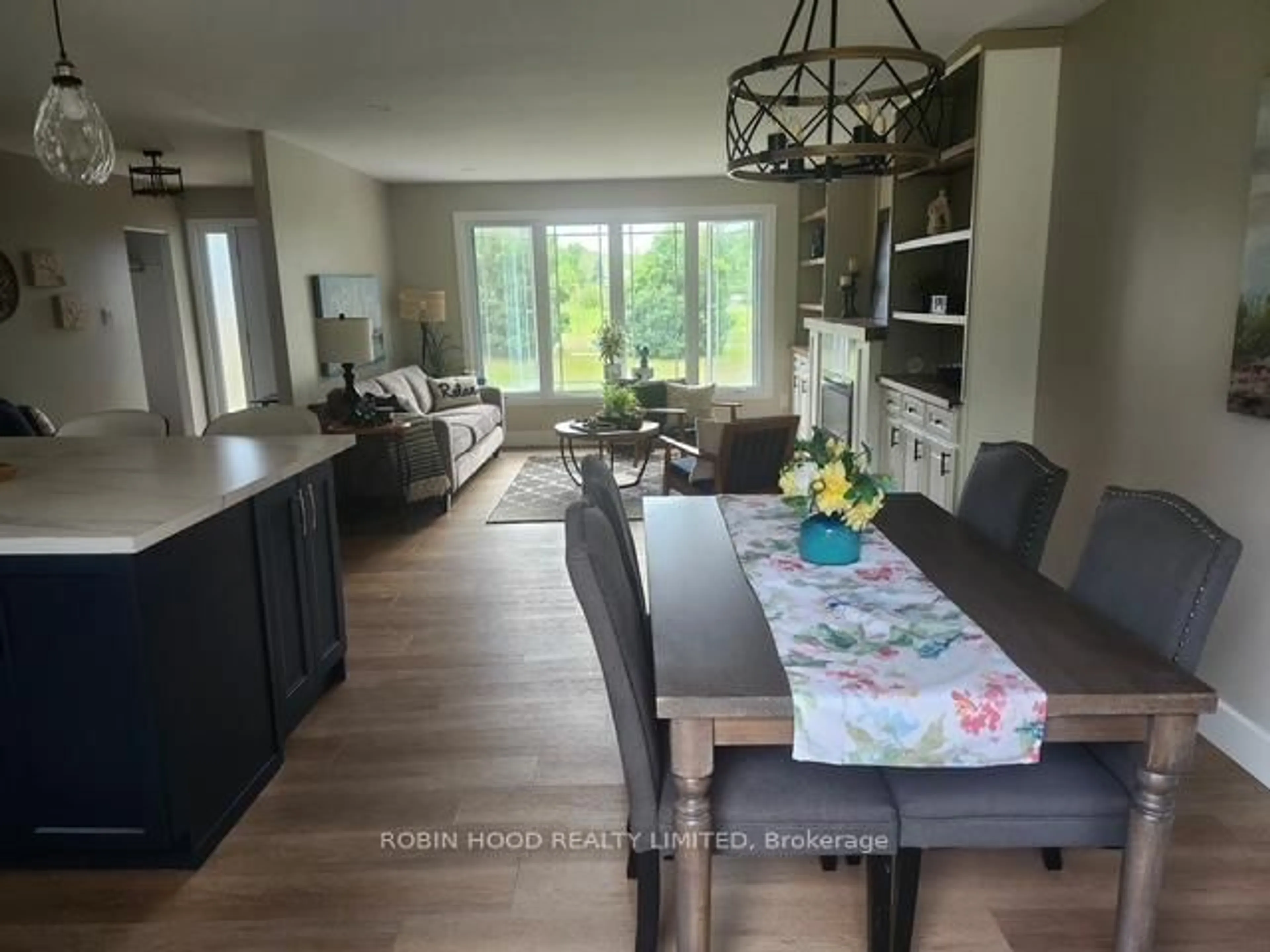 Open concept kitchen, wood/laminate floor for 6259 Poplar St-Gu St #6259, South Glengarry Ontario K0C 1E0