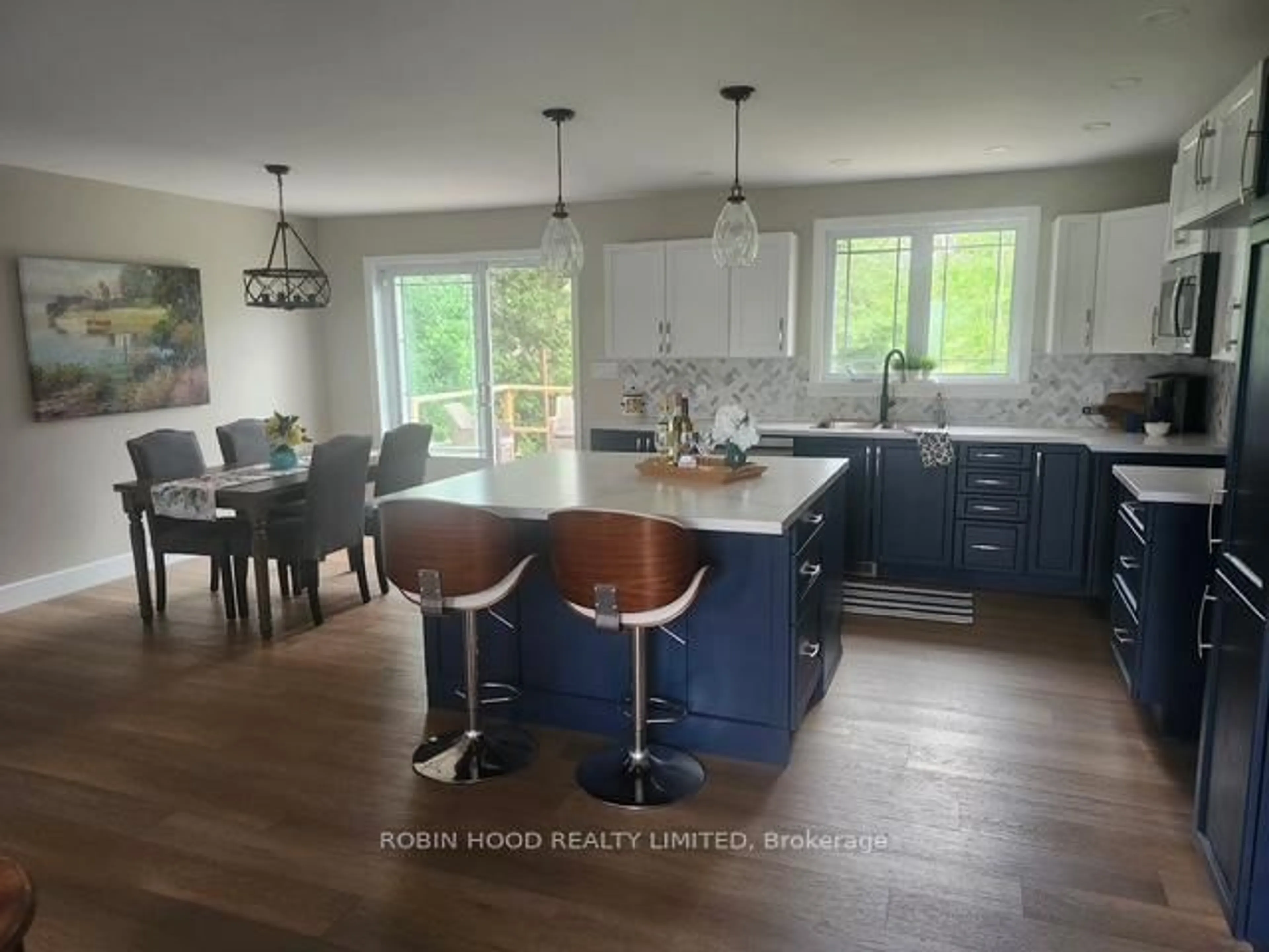 Open concept kitchen, wood/laminate floor for 6259 Poplar St-Gu St #6259, South Glengarry Ontario K0C 1E0