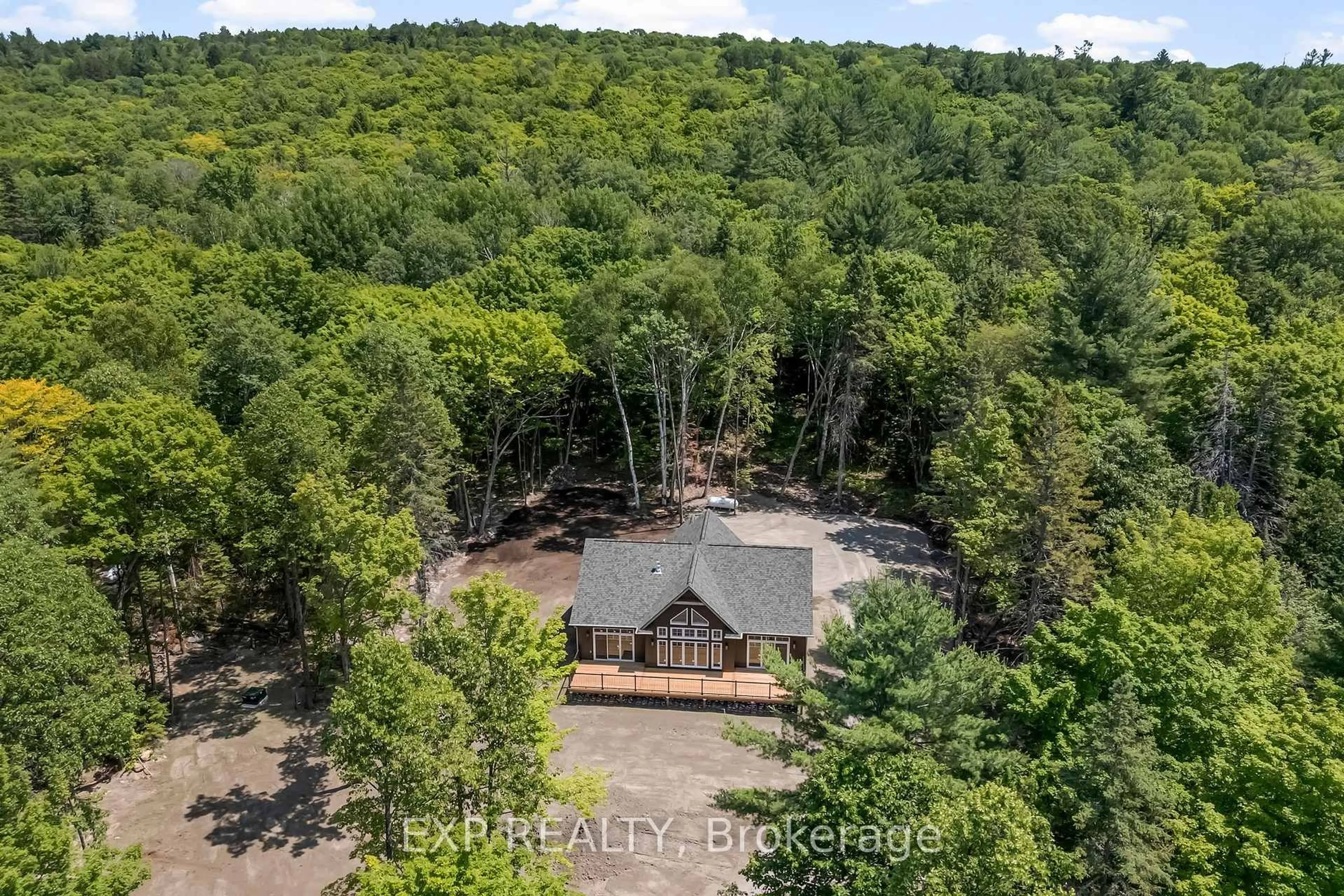 A pic from outside/outdoor area/front of a property/back of a property/a pic from drone, forest/trees view for 747 Lakewoods Dr, Barry's Bay Ontario K0J 1B0