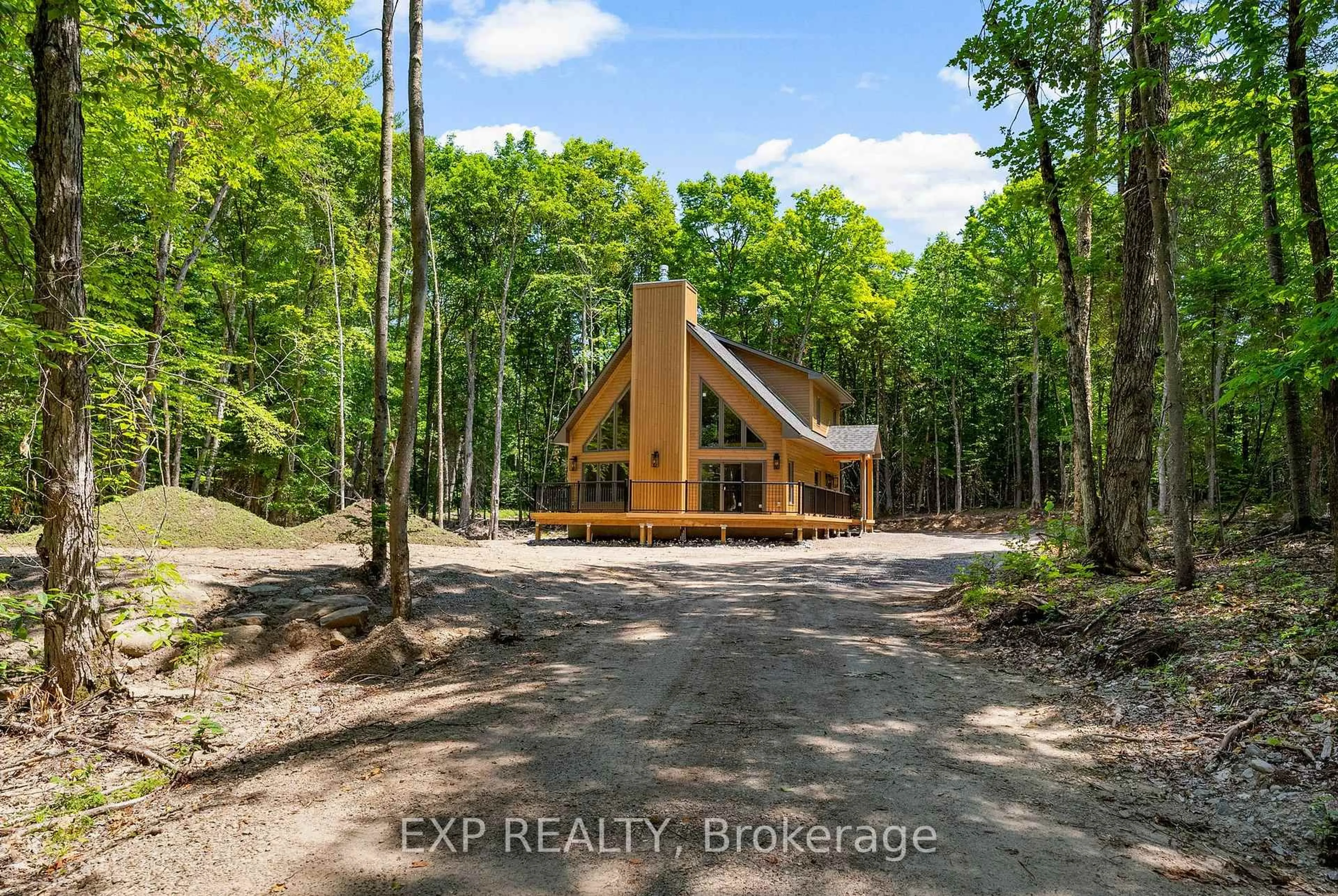 A pic from outside/outdoor area/front of a property/back of a property/a pic from drone, forest/trees view for 743 Lakewoods Dr, Barry's Bay Ontario K0J 1B0