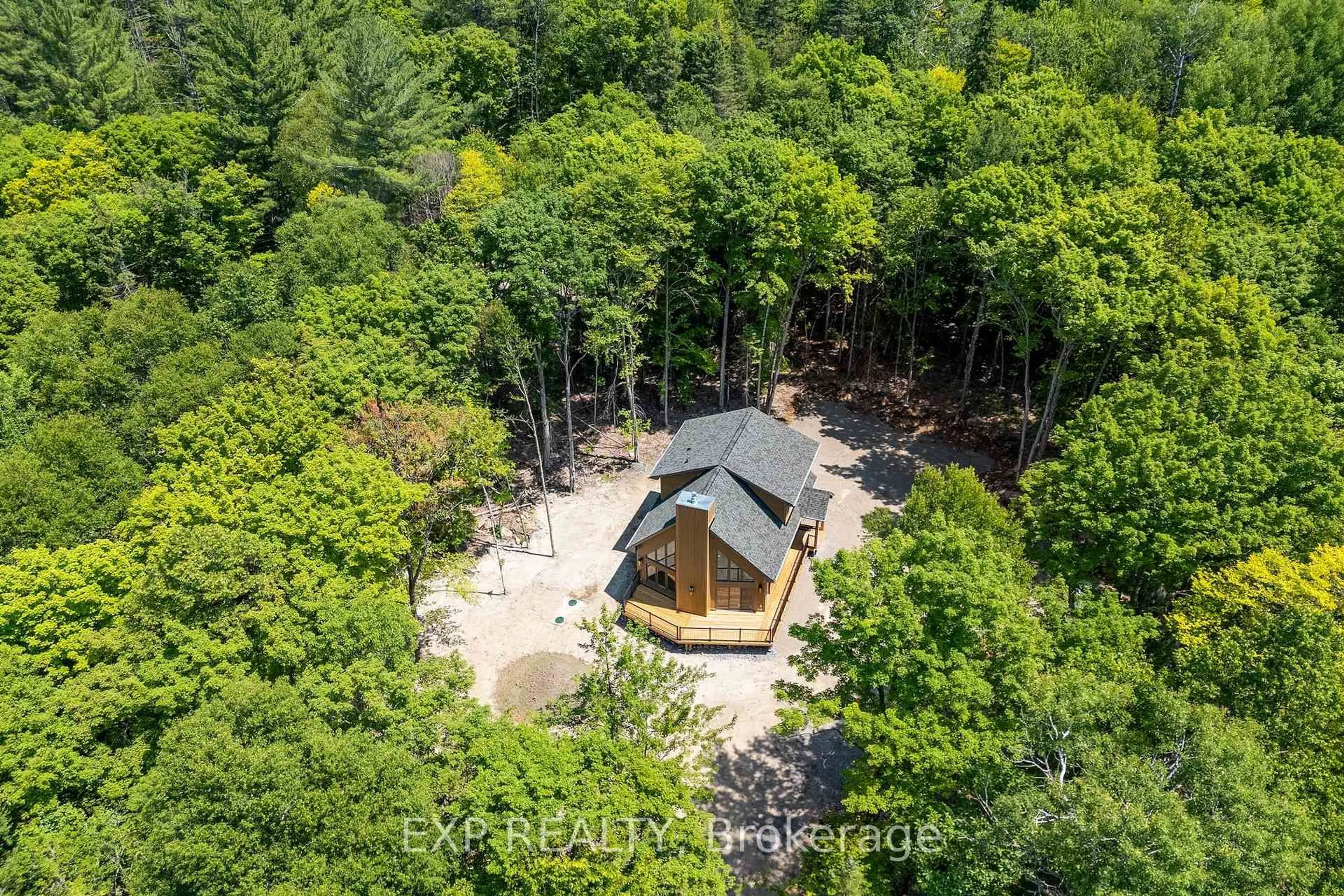 A pic from outside/outdoor area/front of a property/back of a property/a pic from drone, forest/trees view for 743 Lakewoods Dr, Barry's Bay Ontario K0J 1B0