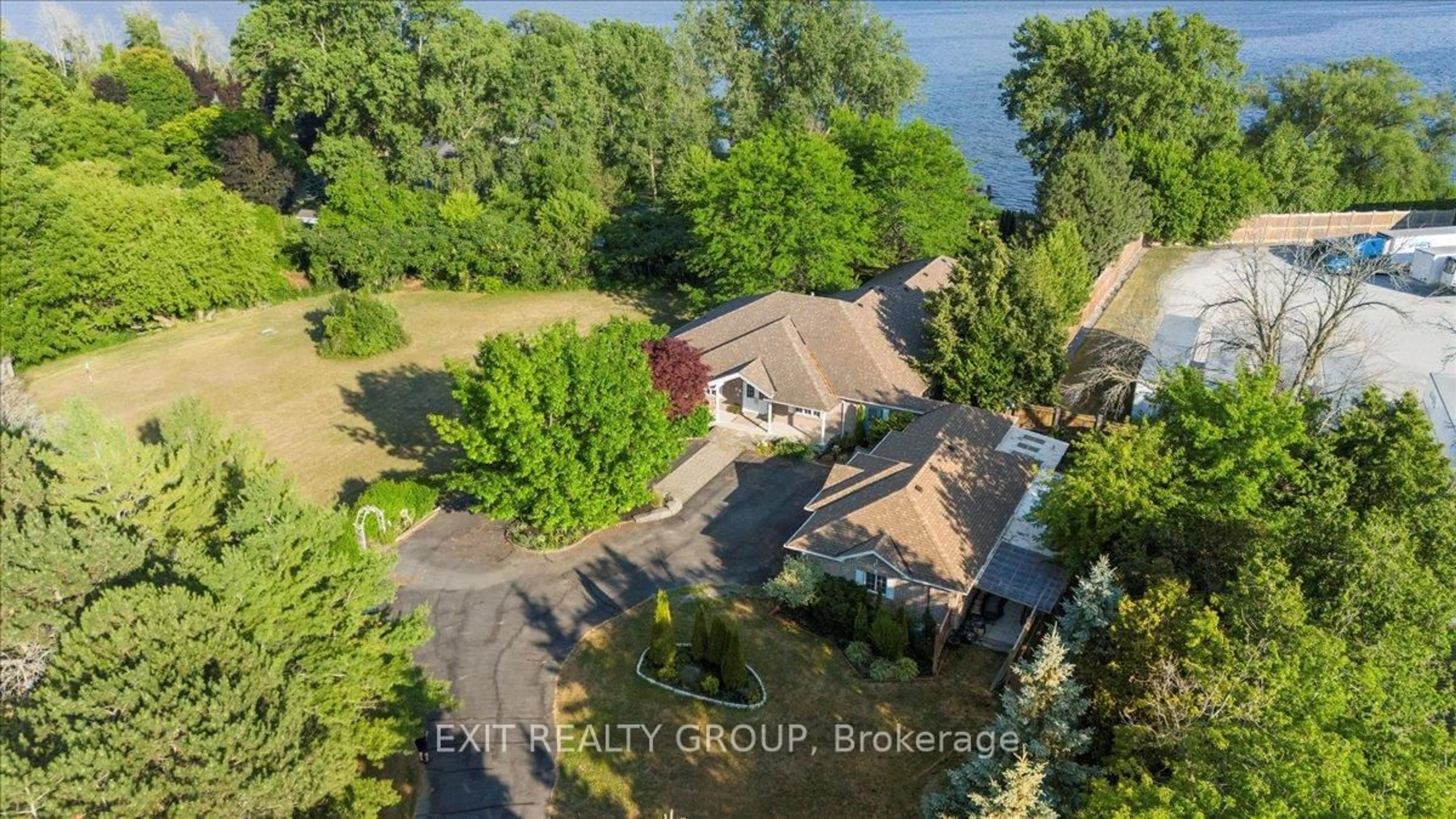 A pic from outside/outdoor area/front of a property/back of a property/a pic from drone, water/lake/river/ocean view for 33 Carrying Place Rd, Quinte West Ontario K8V 3E6