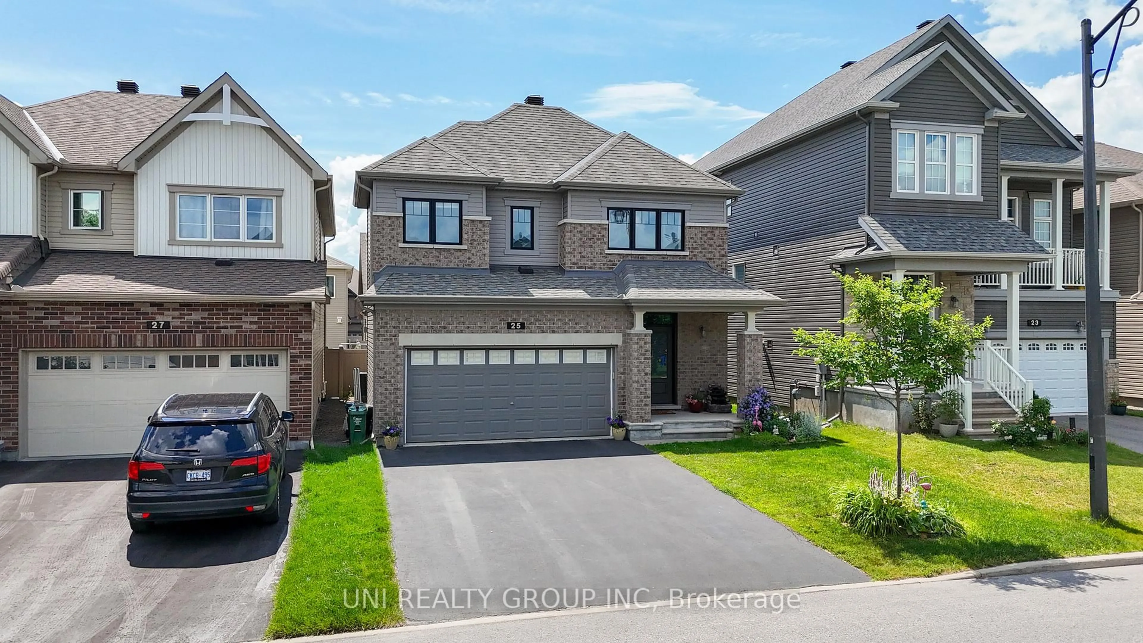 Home with brick exterior material, street for 25 CLONFADDA Terr, Ottawa Ontario K2J 6E7