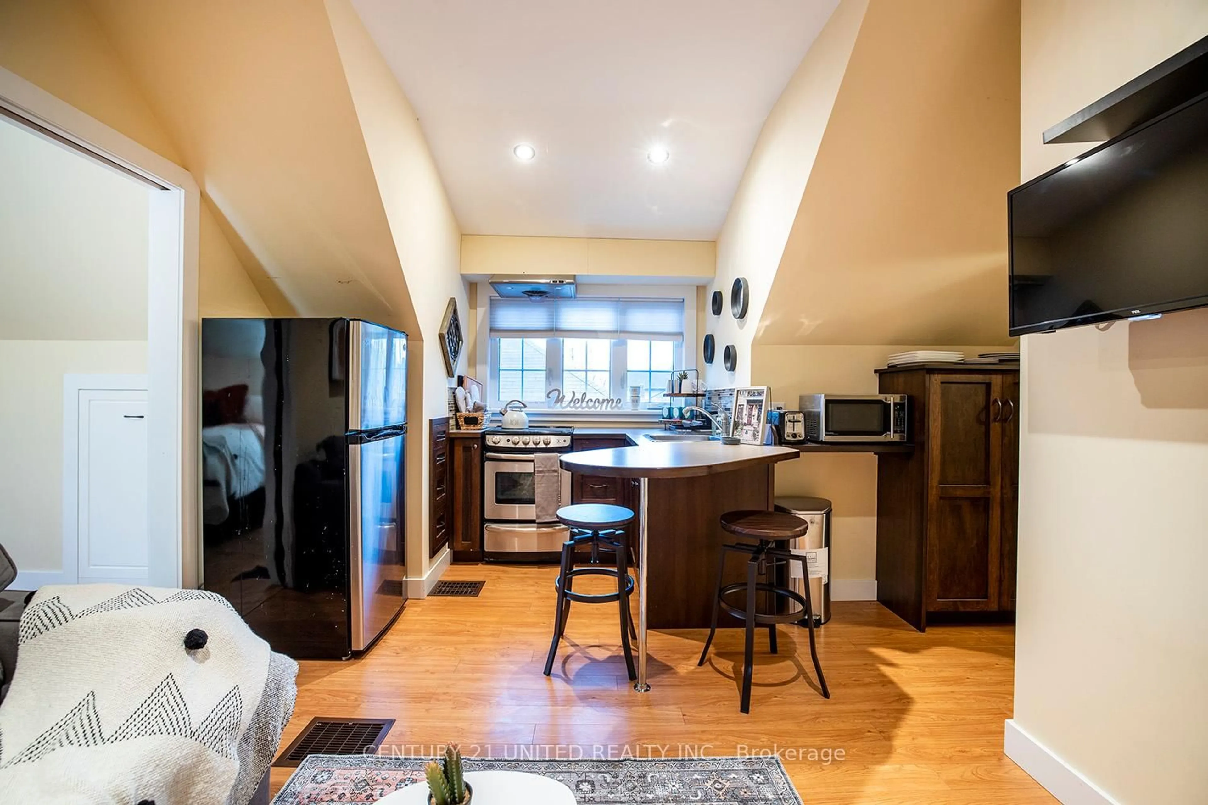 Open concept kitchen, wood/laminate floor for 225 Mark St, Peterborough East Ontario K9H 1V1