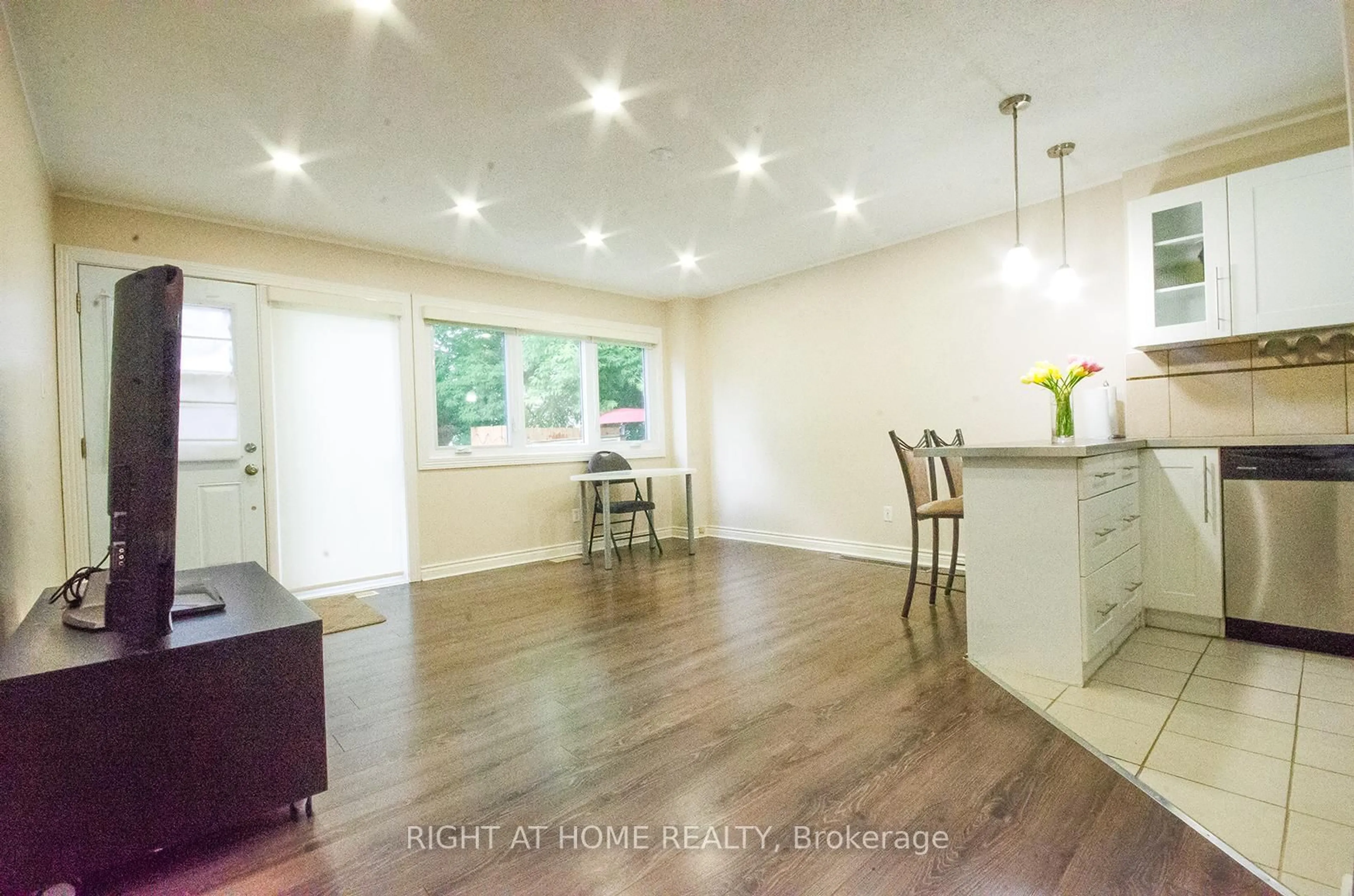 Open concept kitchen, wood/laminate floor for 35 Tybalt Cres, Ottawa Ontario K2H 8J6