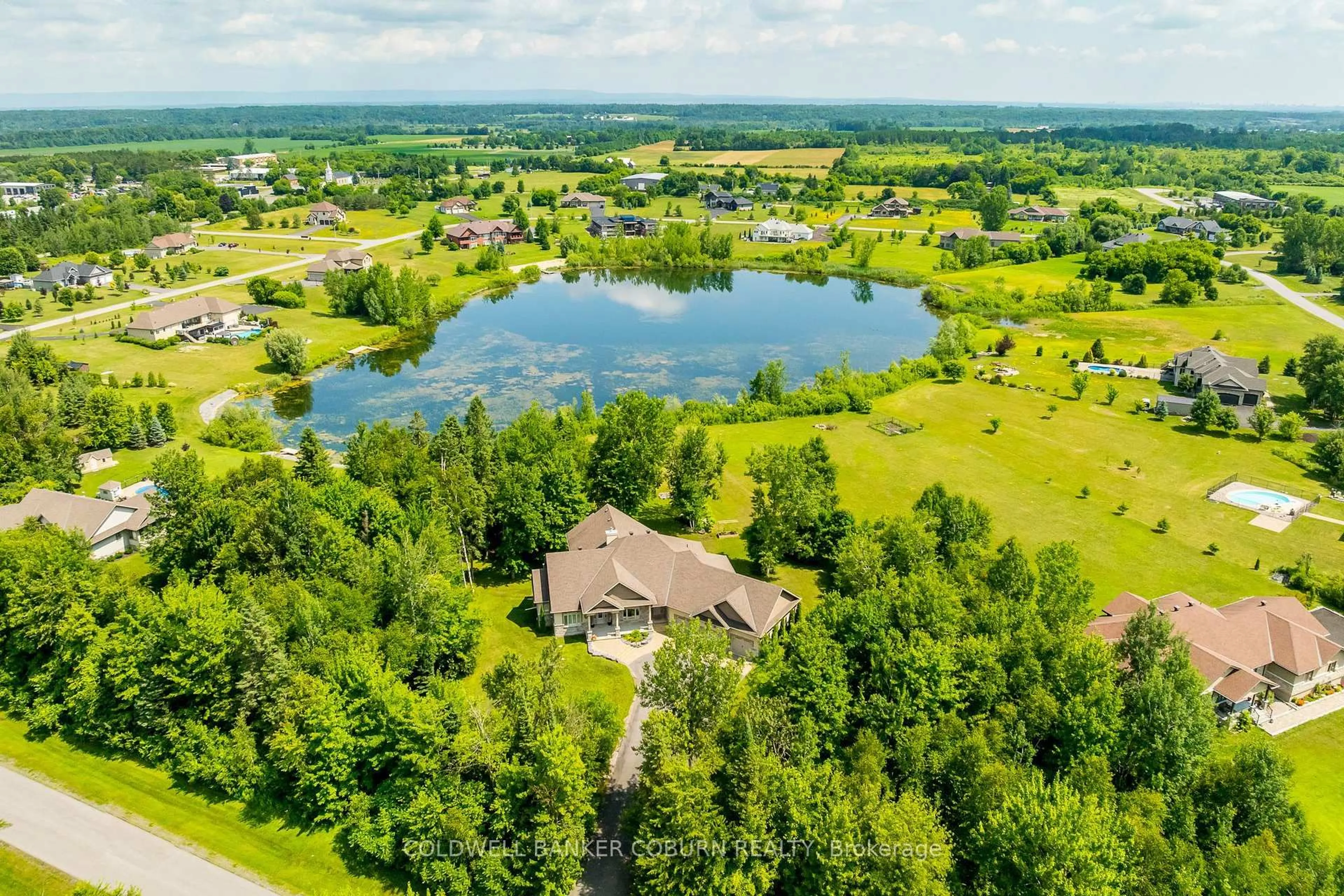 A pic from outside/outdoor area/front of a property/back of a property/a pic from drone, water/lake/river/ocean view for 515 West Lake Circ, Carp Ontario K0A 1L0