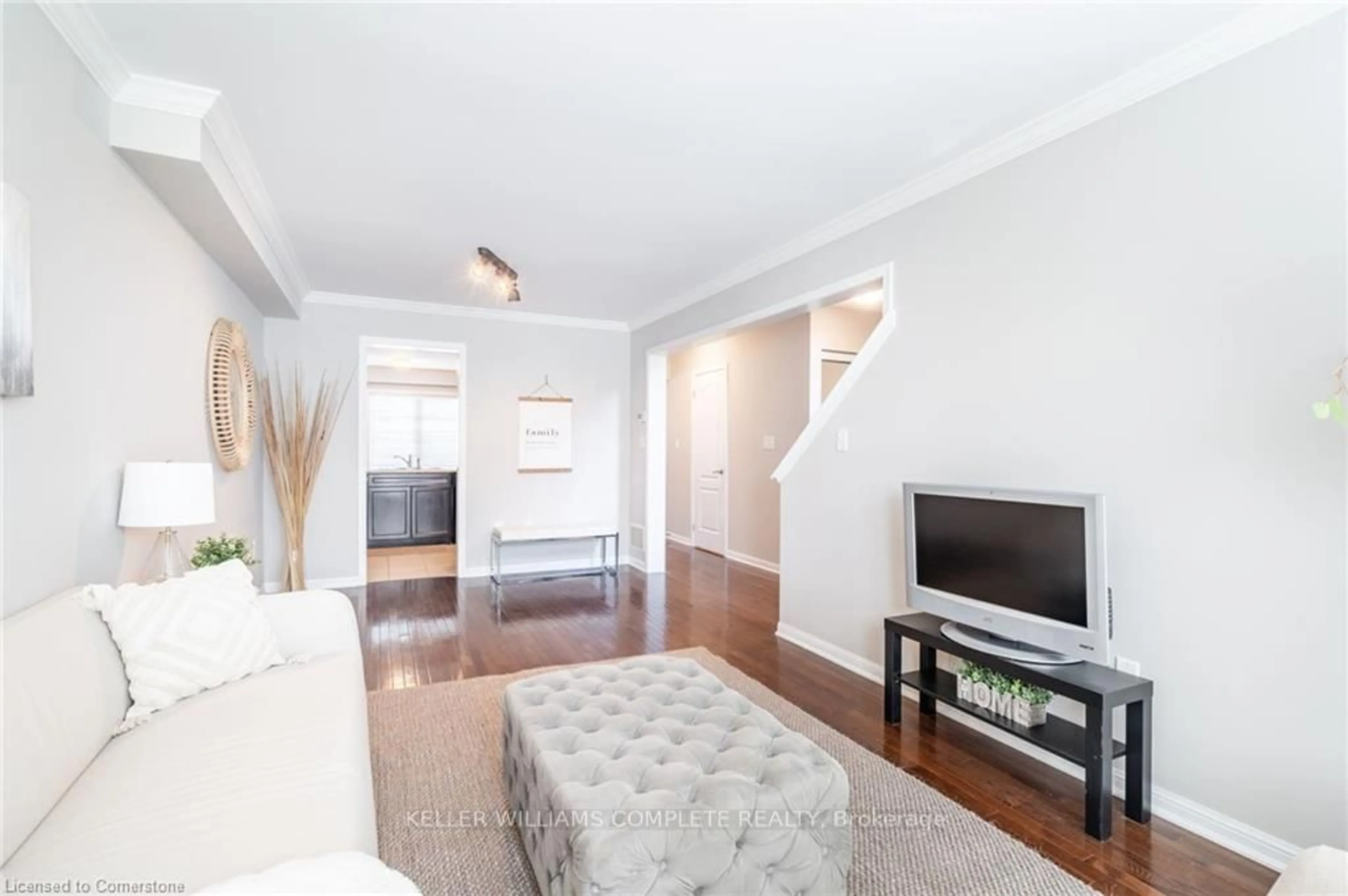 Living room with furniture, wood/laminate floor for 69 Hepworth Cres, Hamilton Ontario L9K 0C4