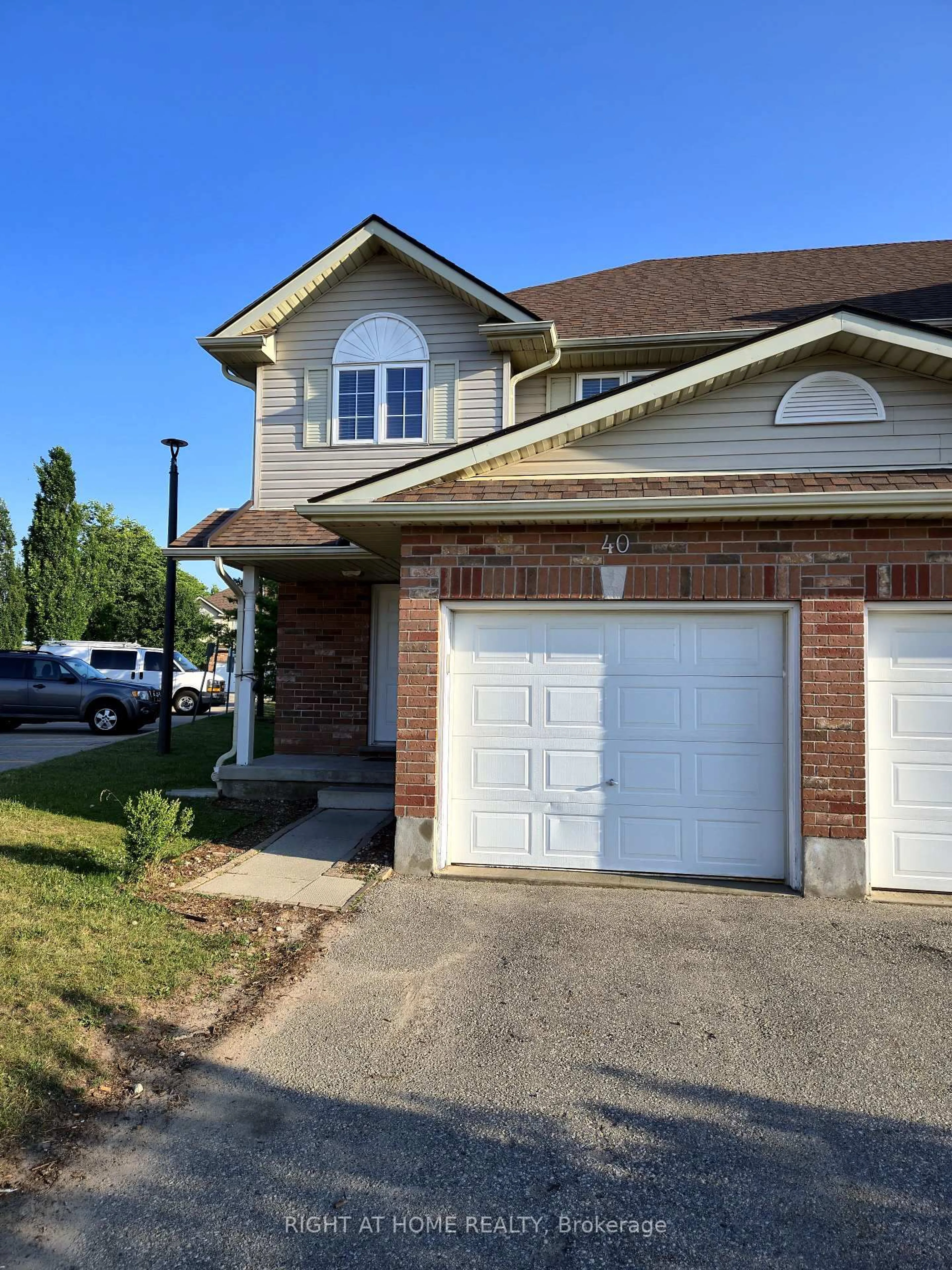 Home with brick exterior material, street for 40 Fallowfield Dr, Kitchener Ontario N2C 0A8