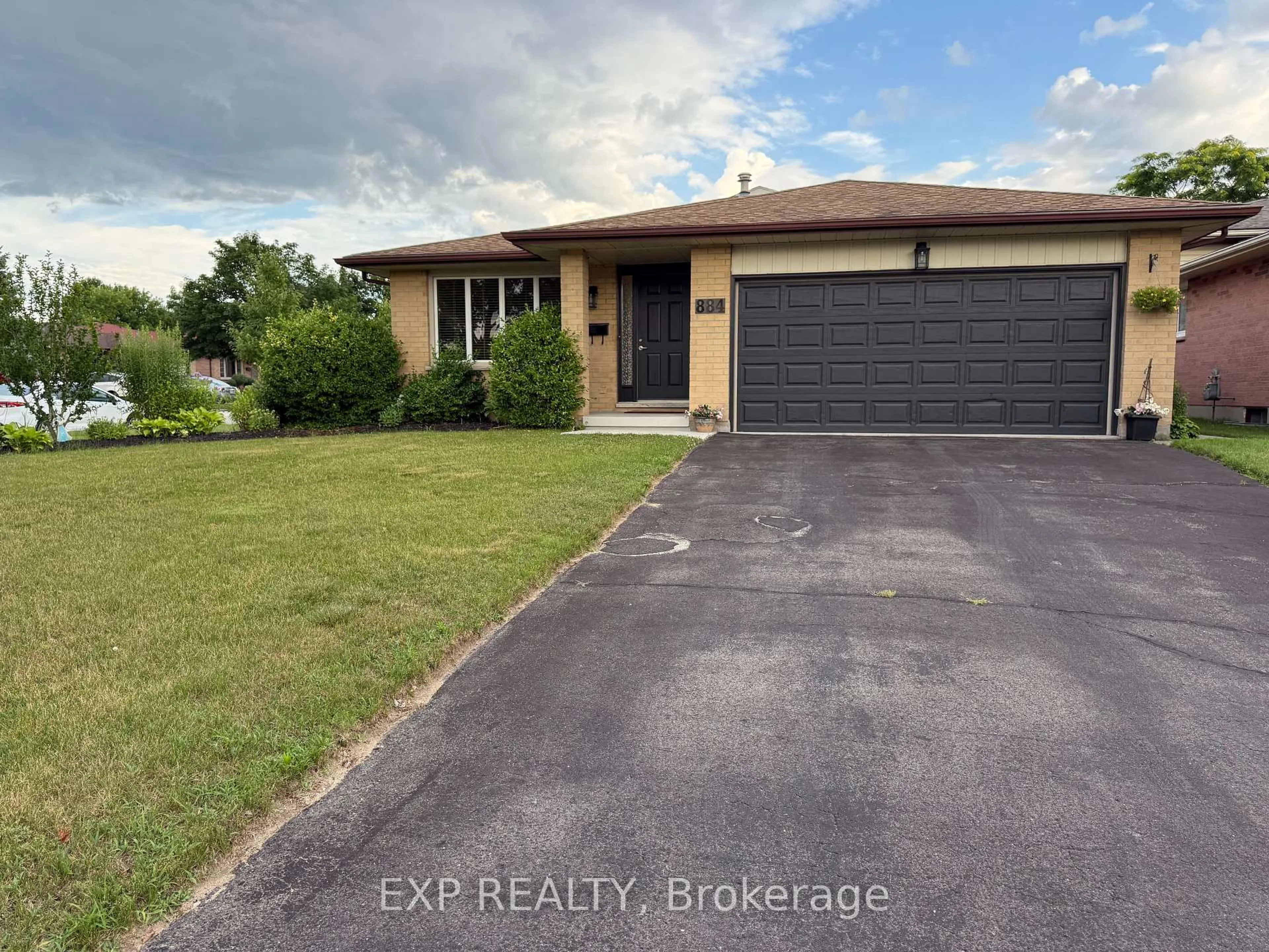 A pic from outside/outdoor area/front of a property/back of a property/a pic from drone, water/lake/river/ocean view for 884 Classic Dr, London East Ontario N5W 5T9