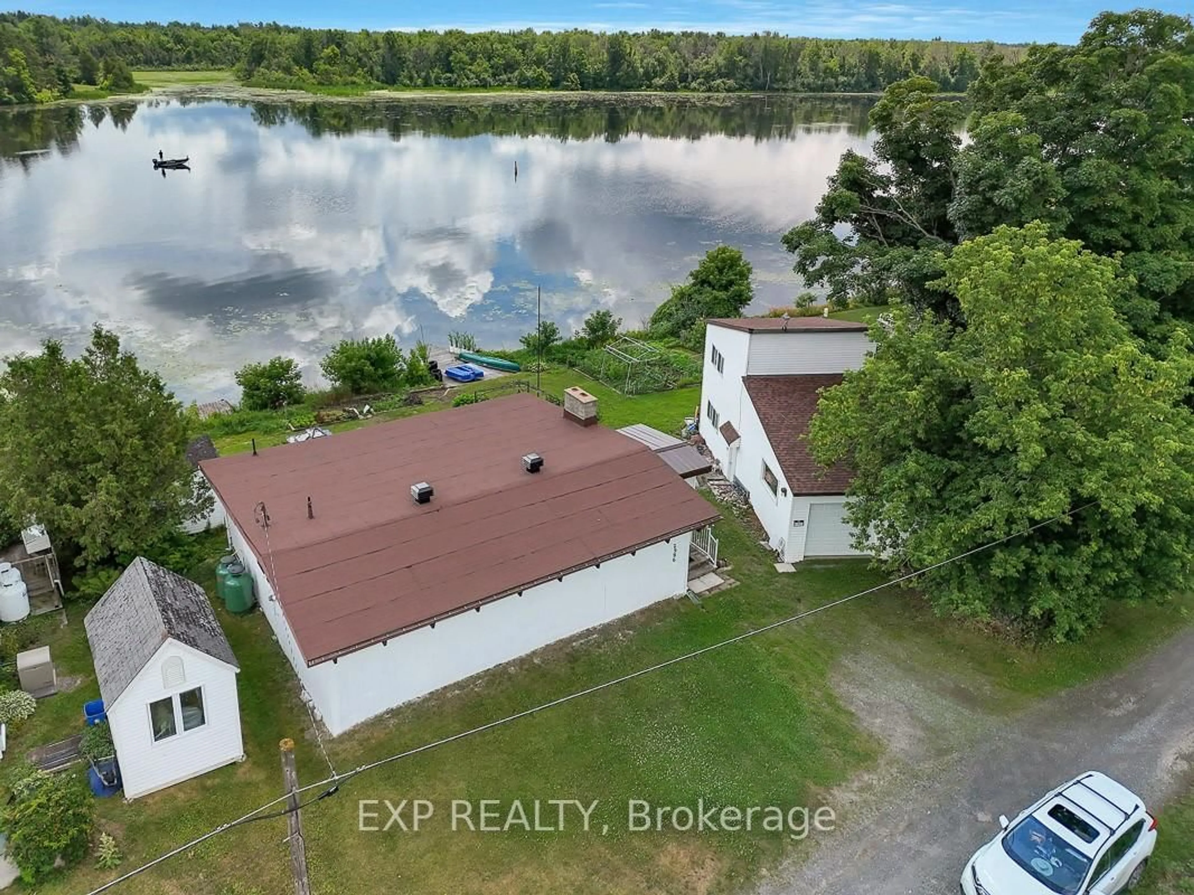 A pic from outside/outdoor area/front of a property/back of a property/a pic from drone, water/lake/river/ocean view for 2986 Beaman Lane, Manotick Ontario K9G 1J0