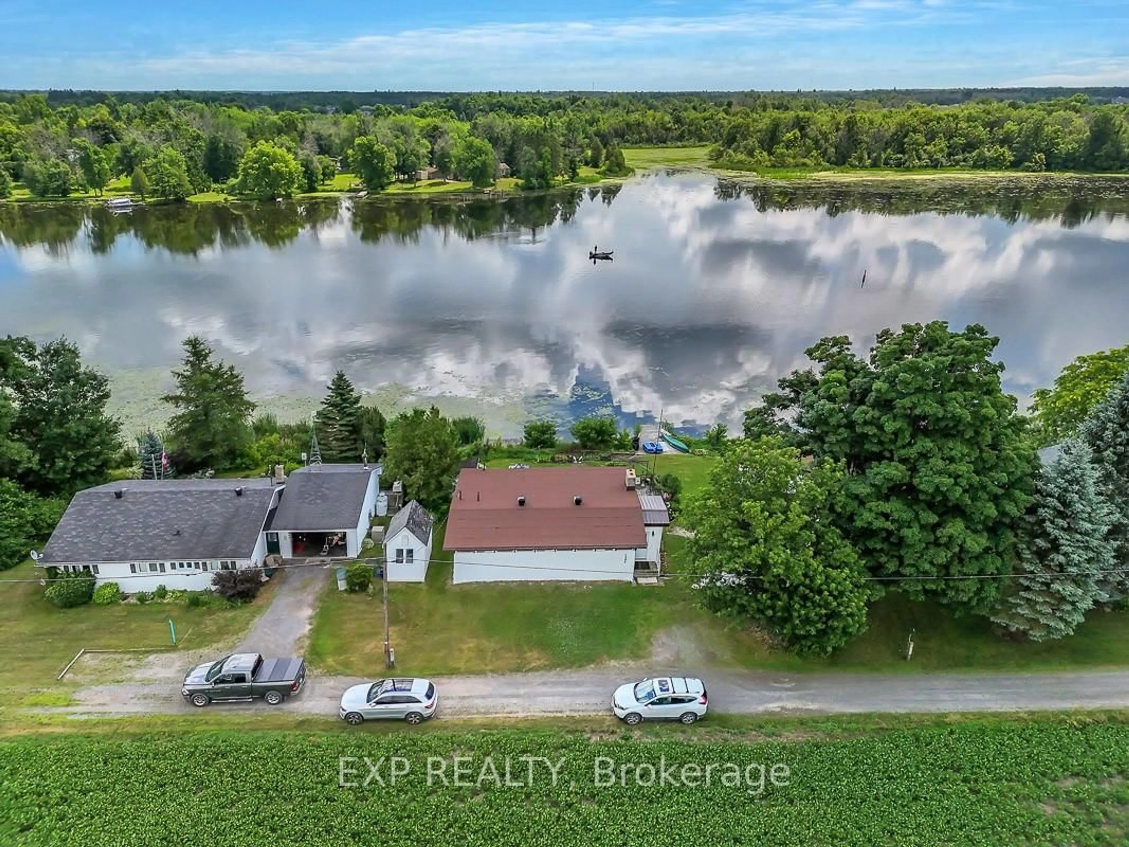 A pic from outside/outdoor area/front of a property/back of a property/a pic from drone, water/lake/river/ocean view for 2986 Beaman Lane, Manotick Ontario K9G 1J0