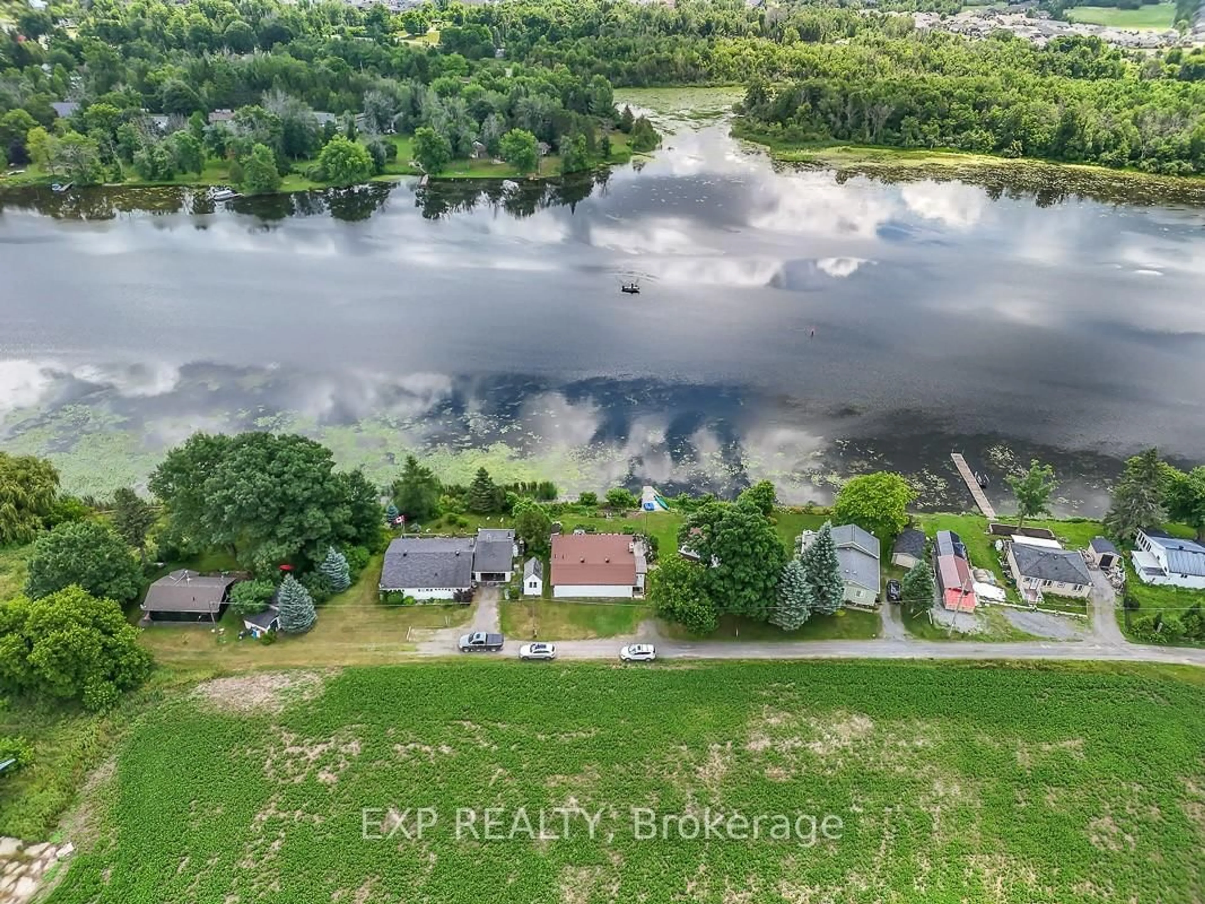 A pic from outside/outdoor area/front of a property/back of a property/a pic from drone, water/lake/river/ocean view for 2986 Beaman Lane, Manotick Ontario K9G 1J0