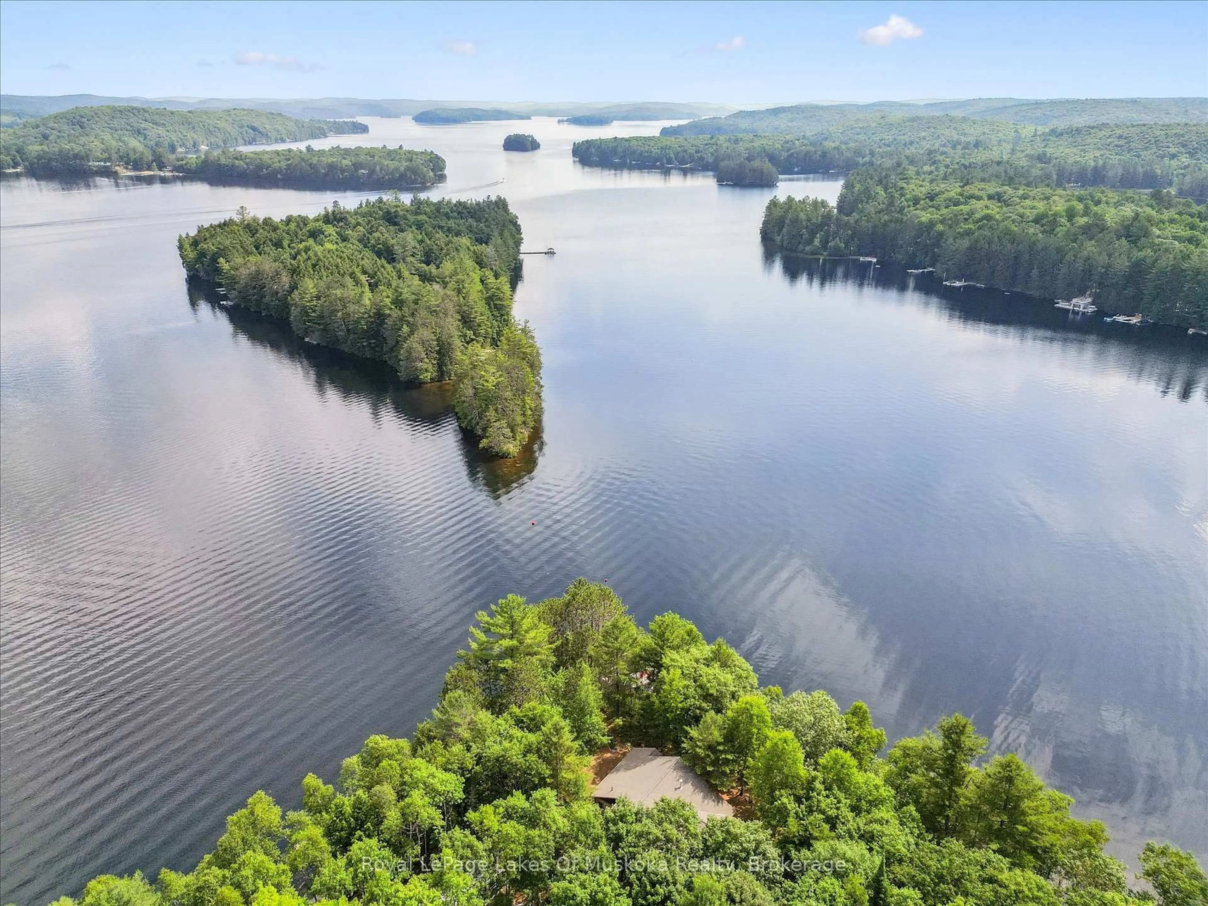 A pic from outside/outdoor area/front of a property/back of a property/a pic from drone, water/lake/river/ocean view for 1176 McComb Point Dr, Algonquin Highlands Ontario P0A 1E0