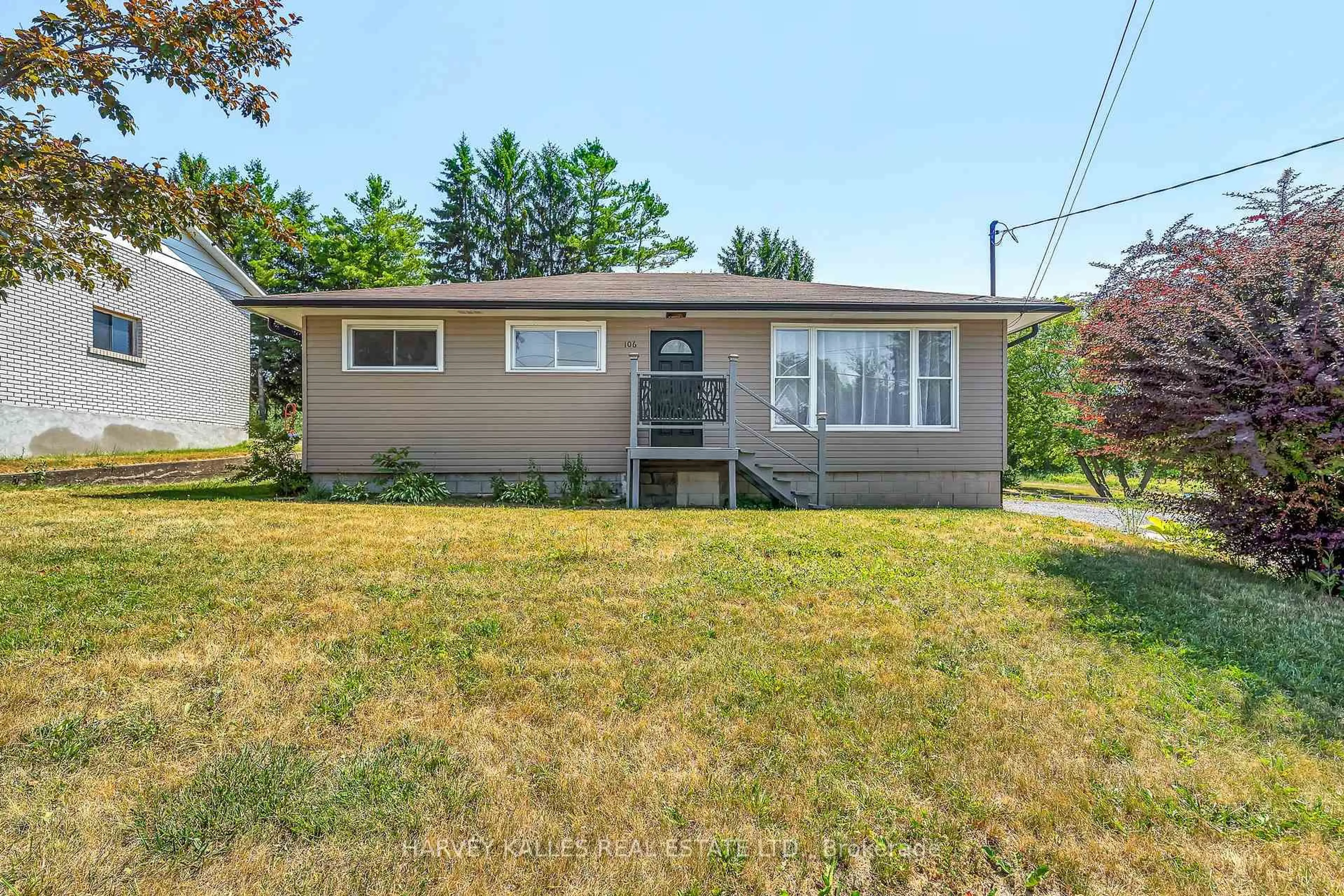 Home with vinyl exterior material, street for 106 Union St, Prince Edward County Ontario K0K 2T0