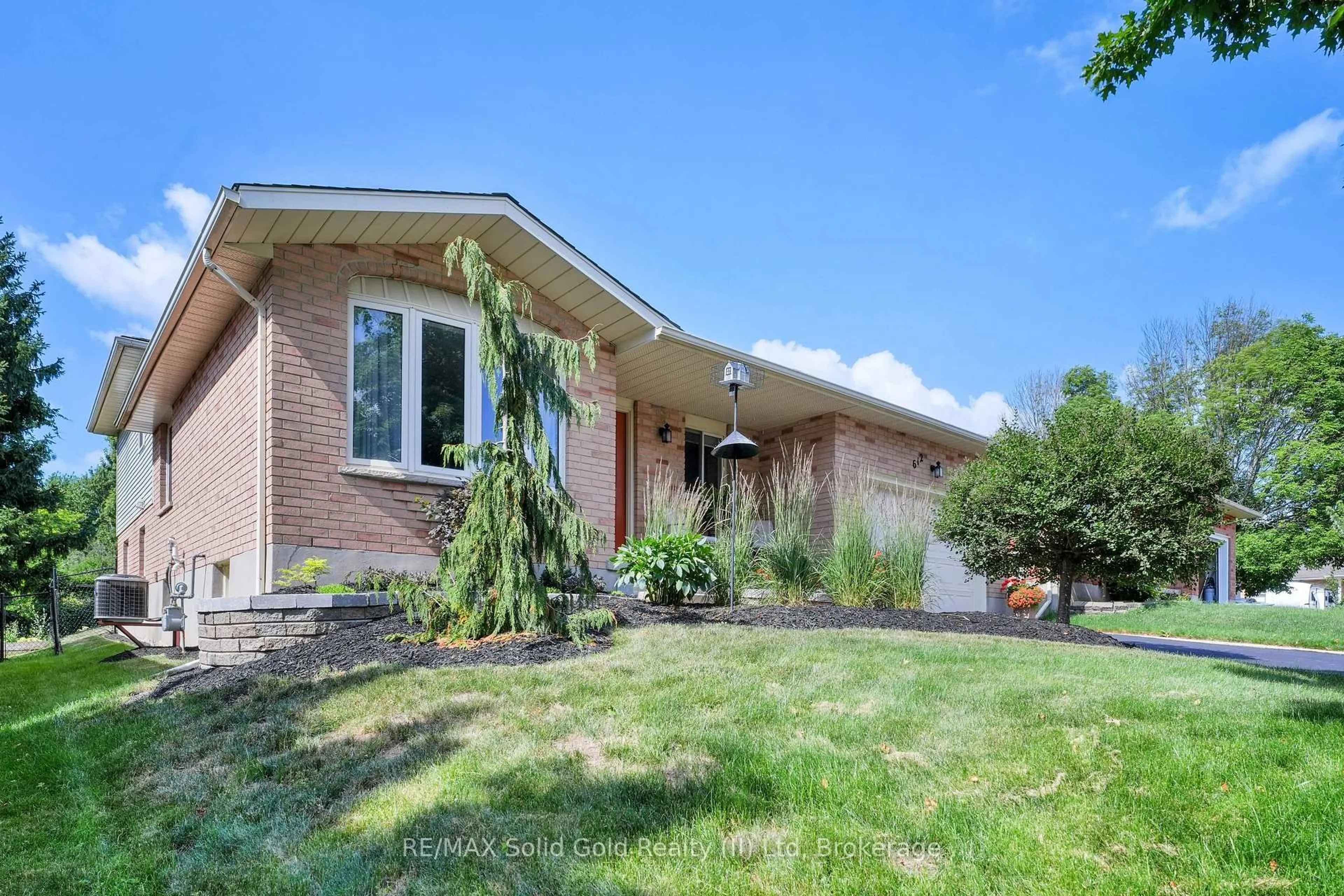 Home with brick exterior material, street for 612 Sprucehurst Cres, Waterloo Ontario N2V 2E3