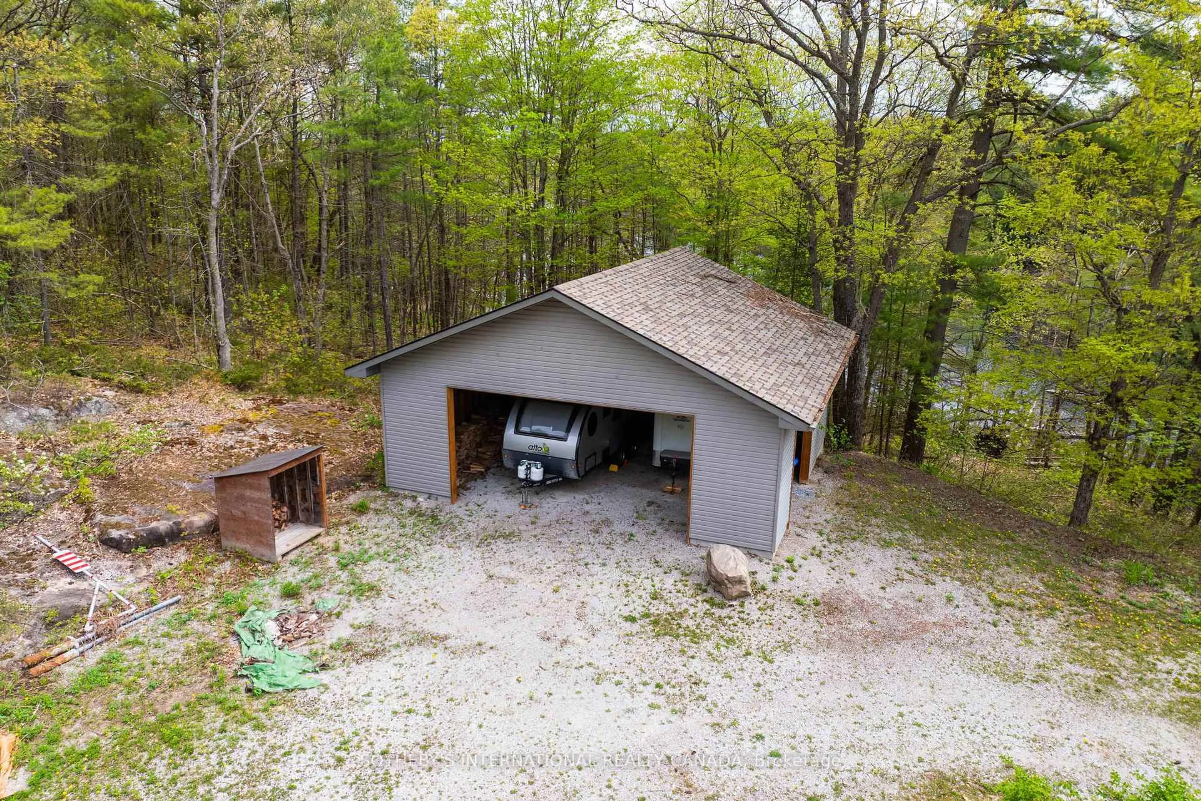 A pic from outside/outdoor area/front of a property/back of a property/a pic from drone, forest/trees view for 1074 Cooks Rd, Gravenhurst Ontario P1P 1R3
