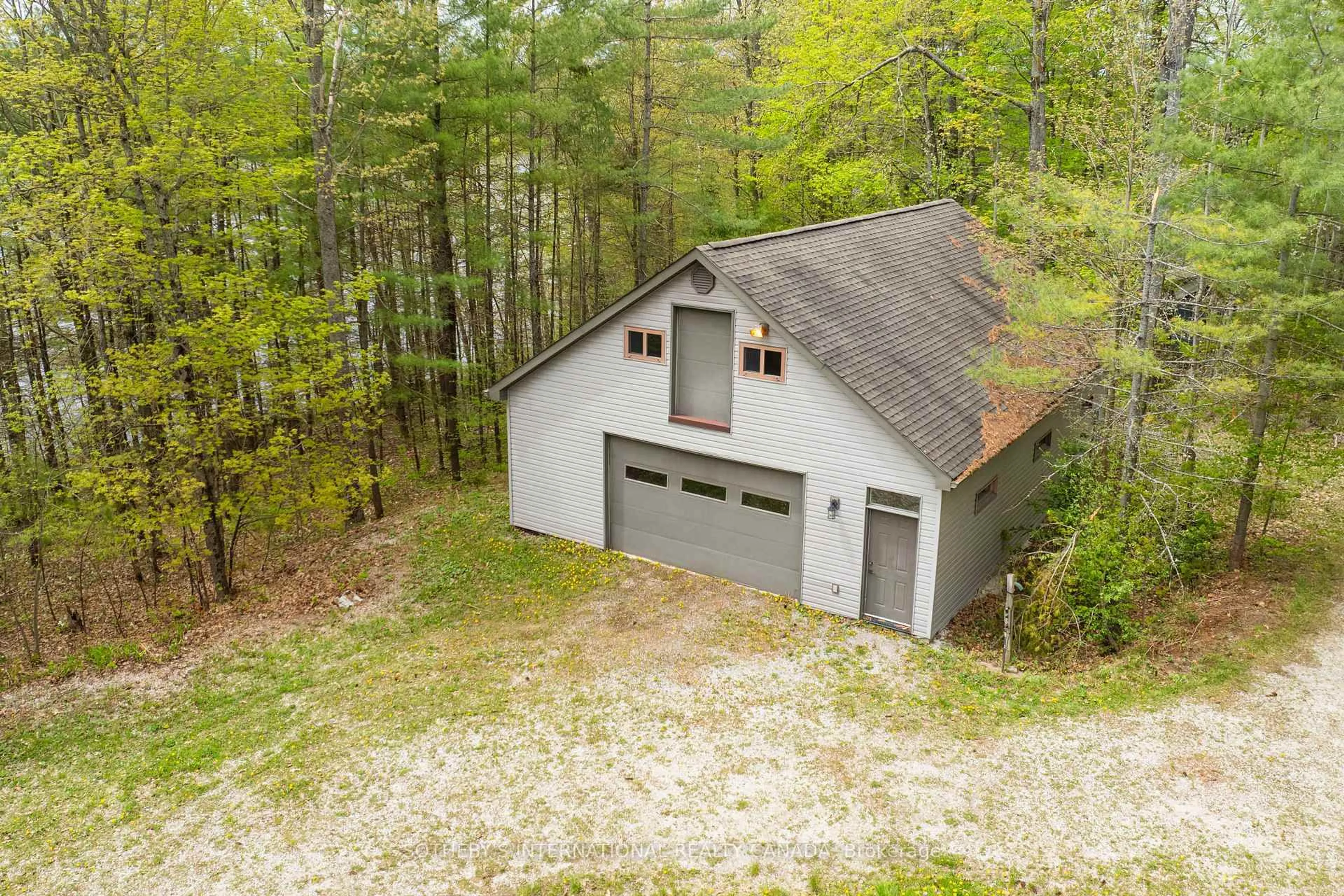 A pic from outside/outdoor area/front of a property/back of a property/a pic from drone, forest/trees view for 1074 Cooks Rd, Gravenhurst Ontario P1P 1R3