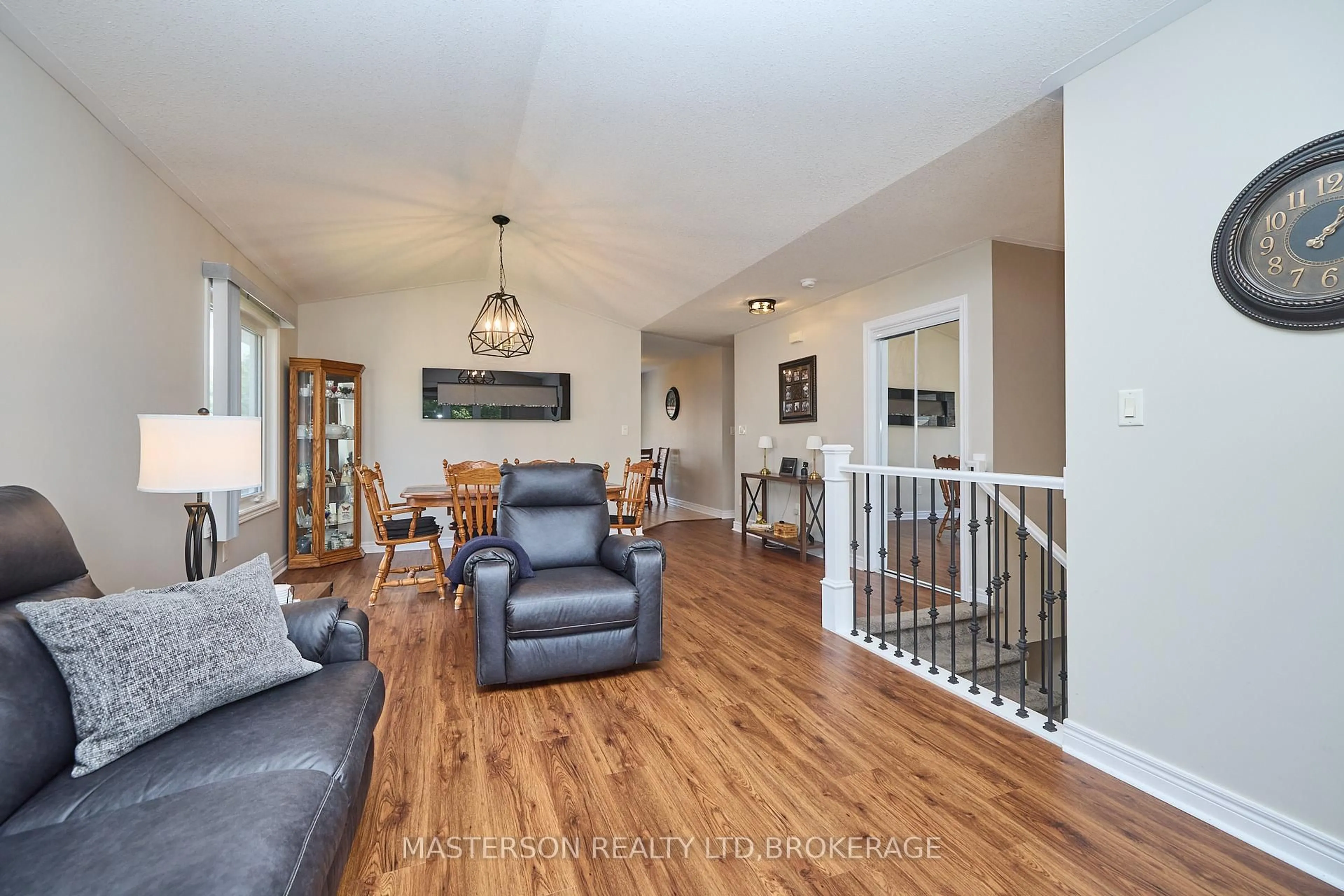 Living room with furniture, wood/laminate floor for 6906 Kelly Dr, Niagara Falls Ontario L2H 3J7