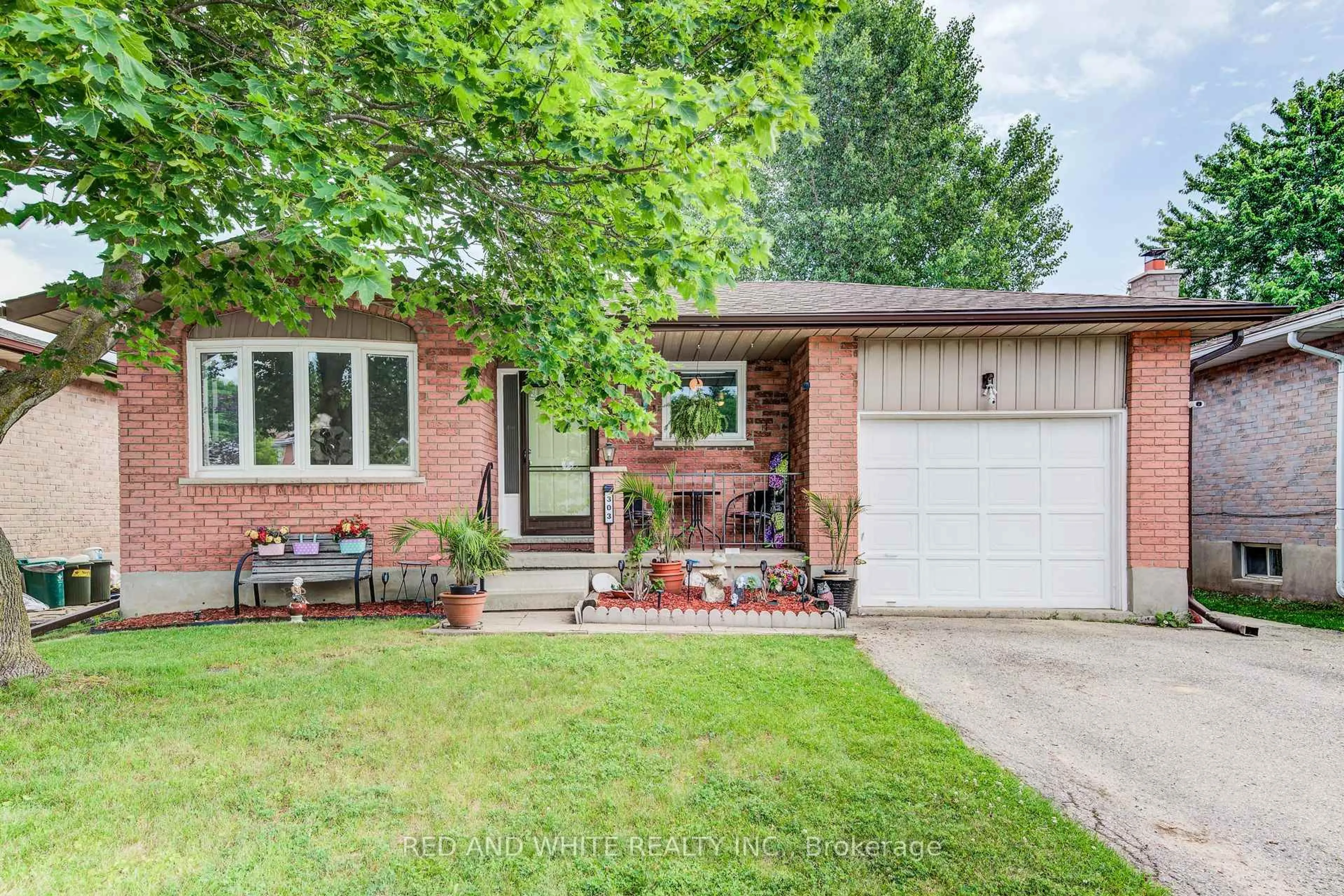 Home with brick exterior material, street for 303 Conservation Dr, Waterloo Ontario N2V 1V5