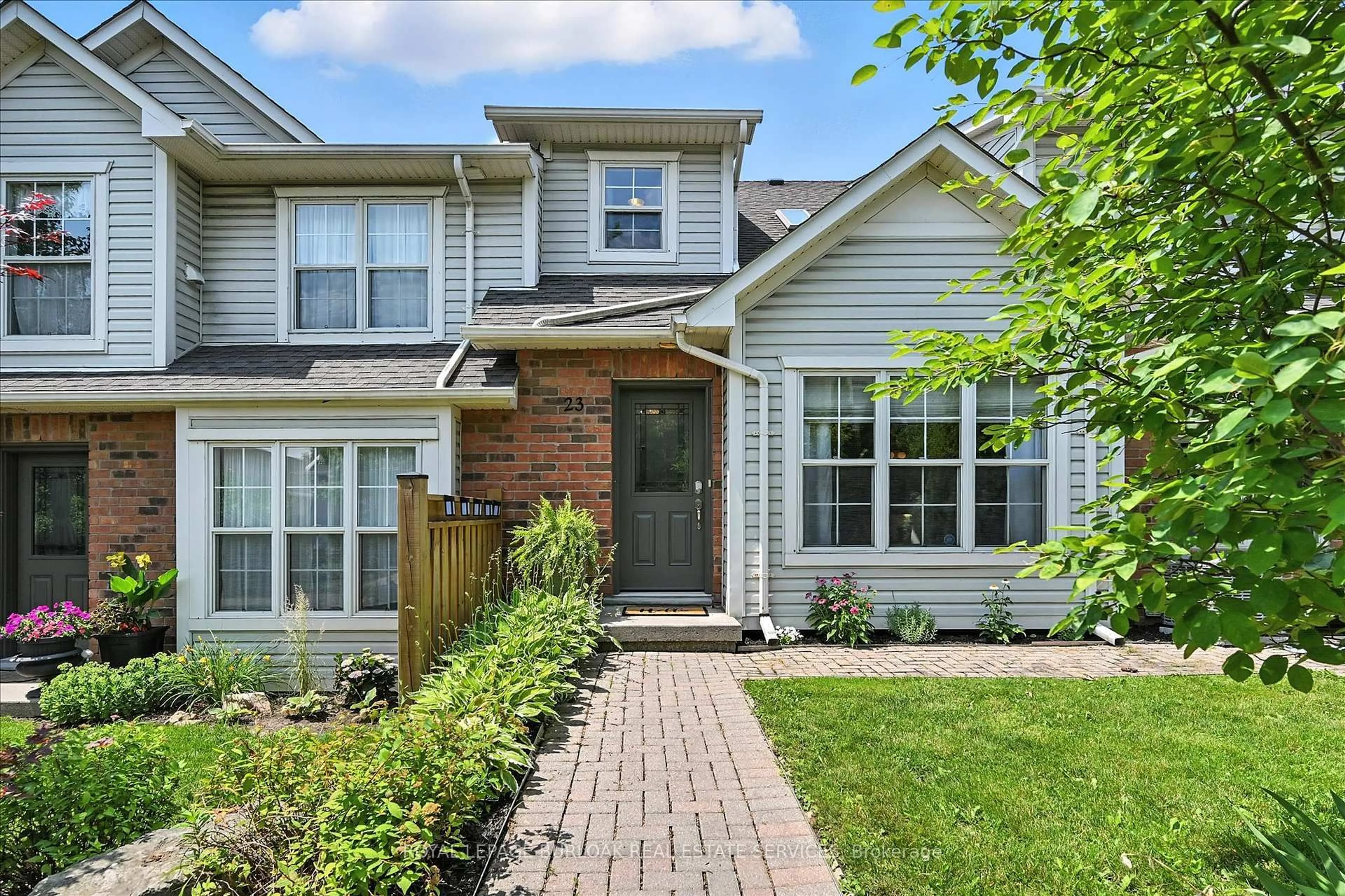 Home with brick exterior material, street for 1085 Harrogate Dr #23, Hamilton Ontario L9K 1R2