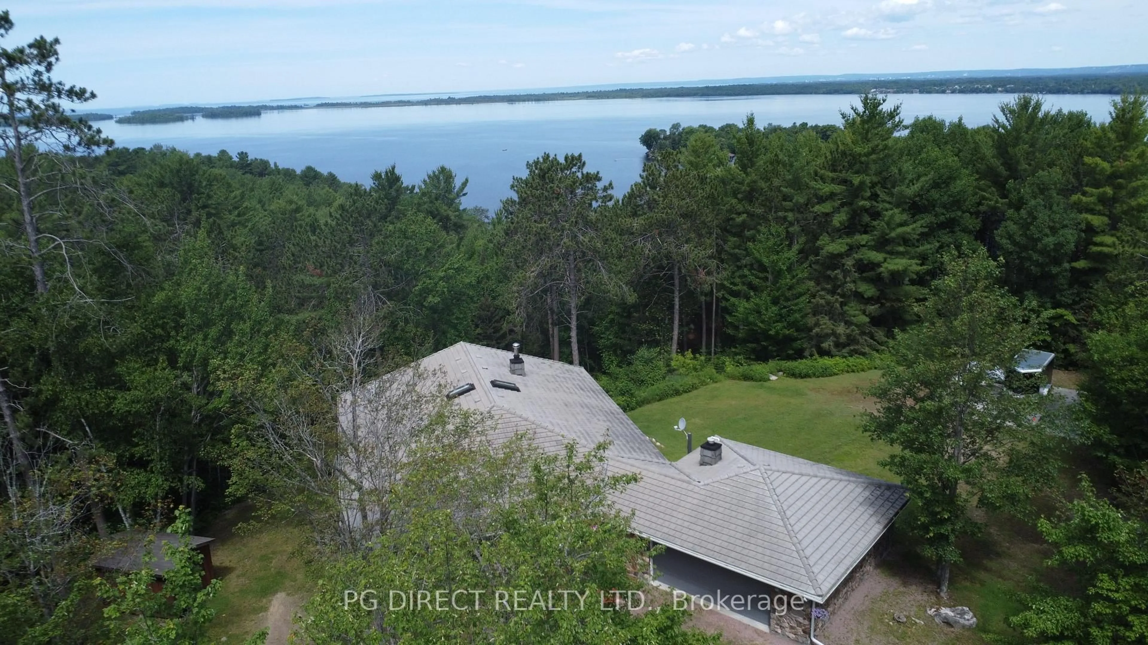 A pic from outside/outdoor area/front of a property/back of a property/a pic from drone, water/lake/river/ocean view for 2398 Highway 94, Callander Ontario P0H 1H0