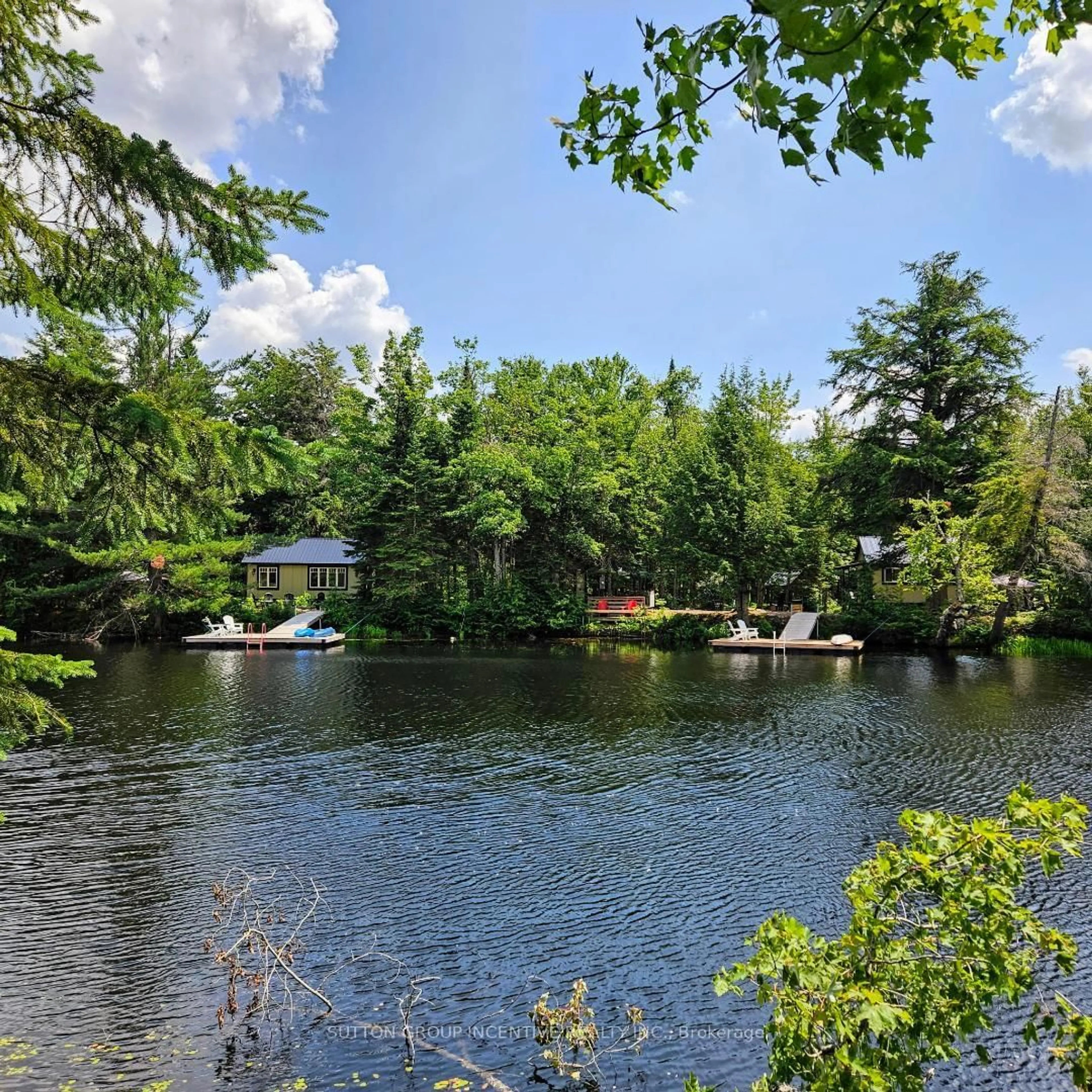 A pic from outside/outdoor area/front of a property/back of a property/a pic from drone, water/lake/river/ocean view for 1559 118 Highway, Bracebridge Ontario P1L 1X1