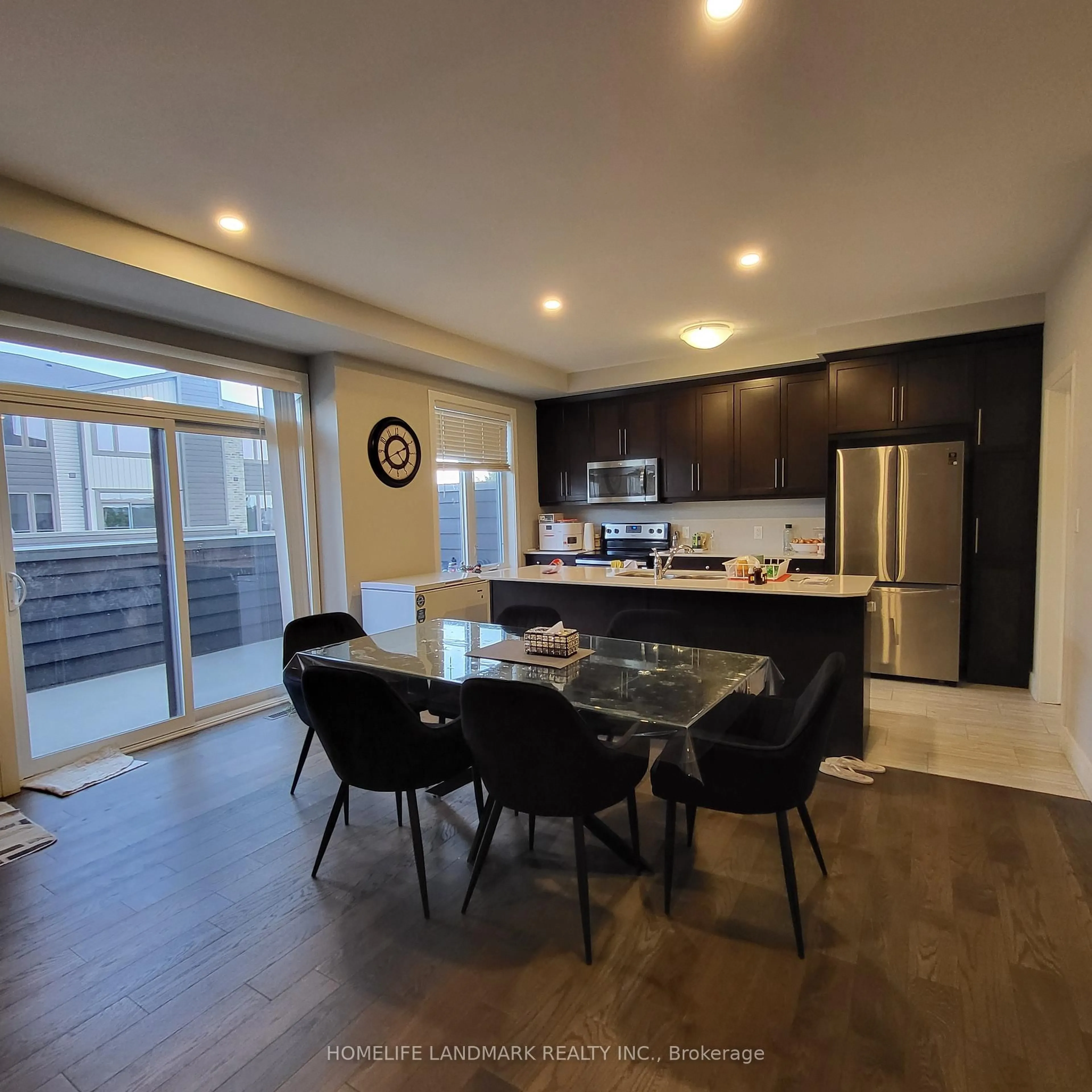 Open concept kitchen, wood/laminate floor for 1960 Dalmagarry Rd #60, London North Ontario N6G 0T8