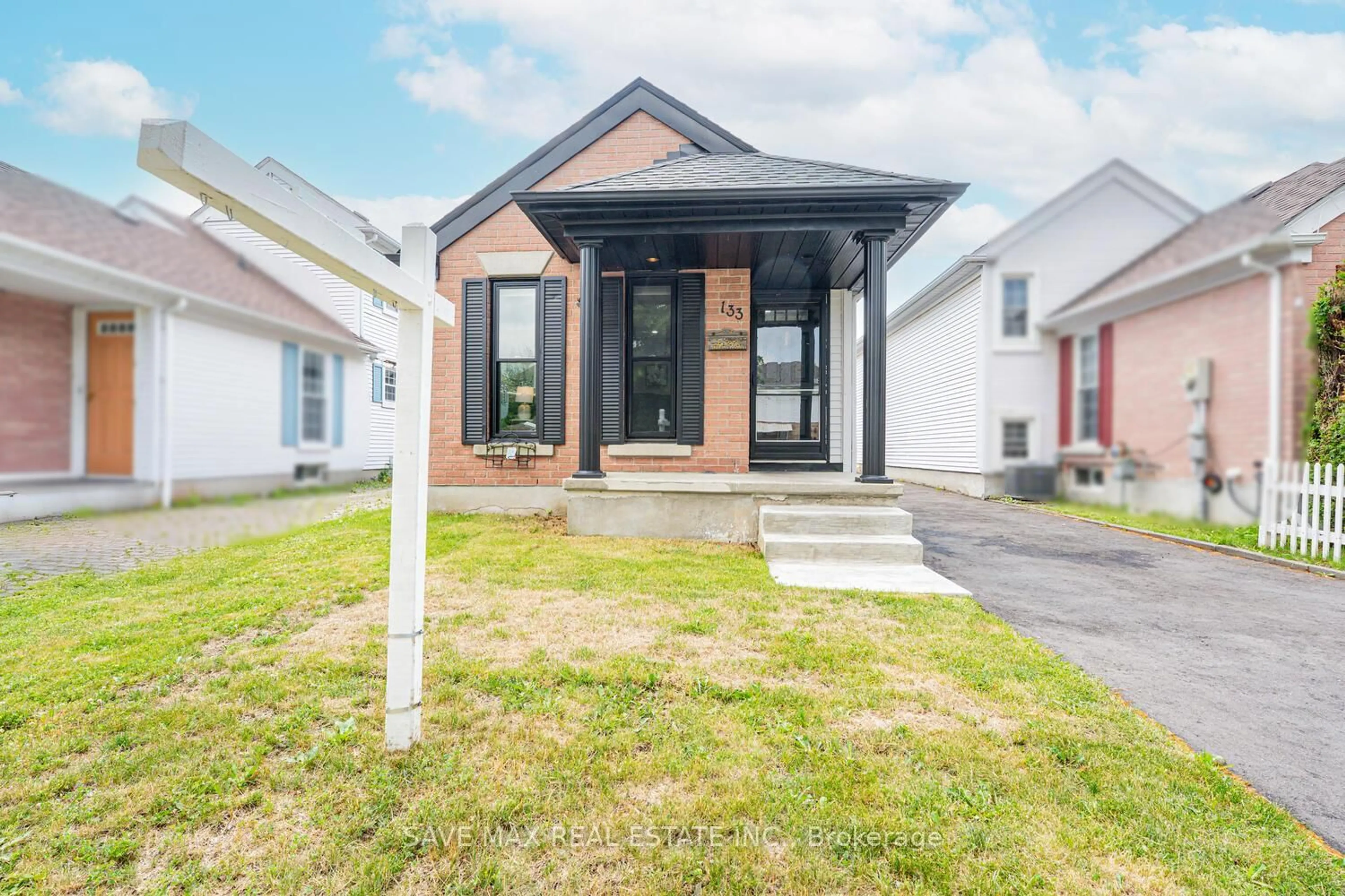 Home with brick exterior material, street for 133 Wake Robin Dr, Kitchener Ontario N2E 3L6