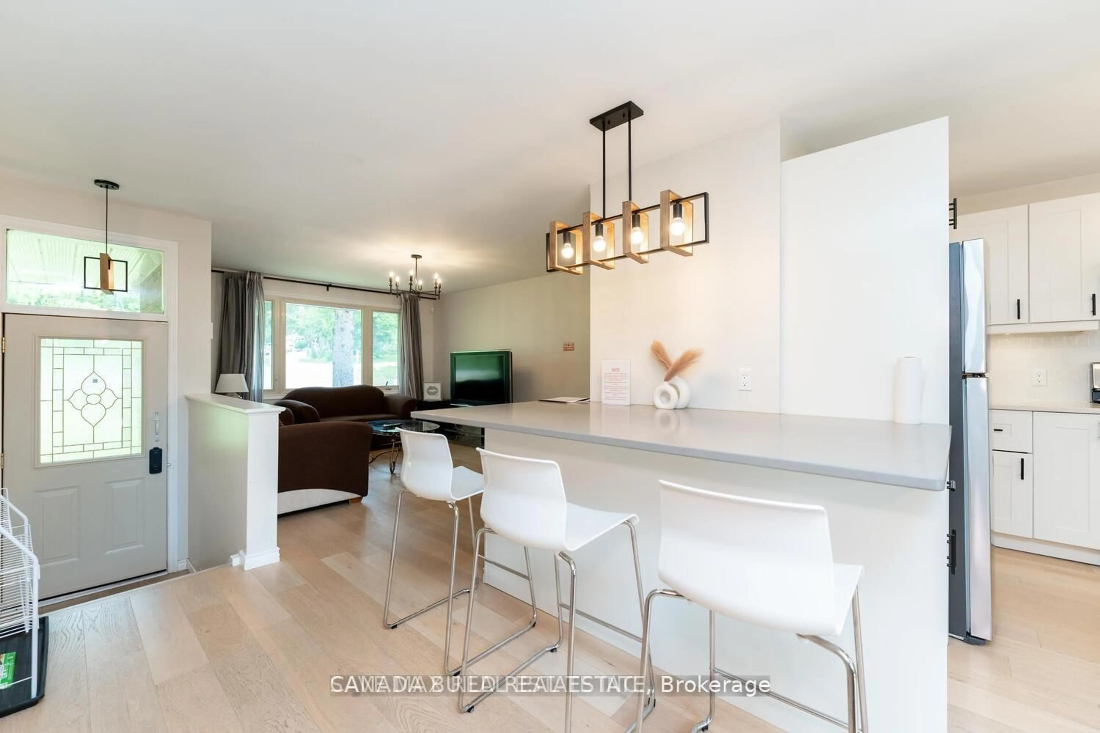 Open concept kitchen, wood/laminate floor for 3220 Lakefield Rd, Selwyn Ontario K9J 6X5