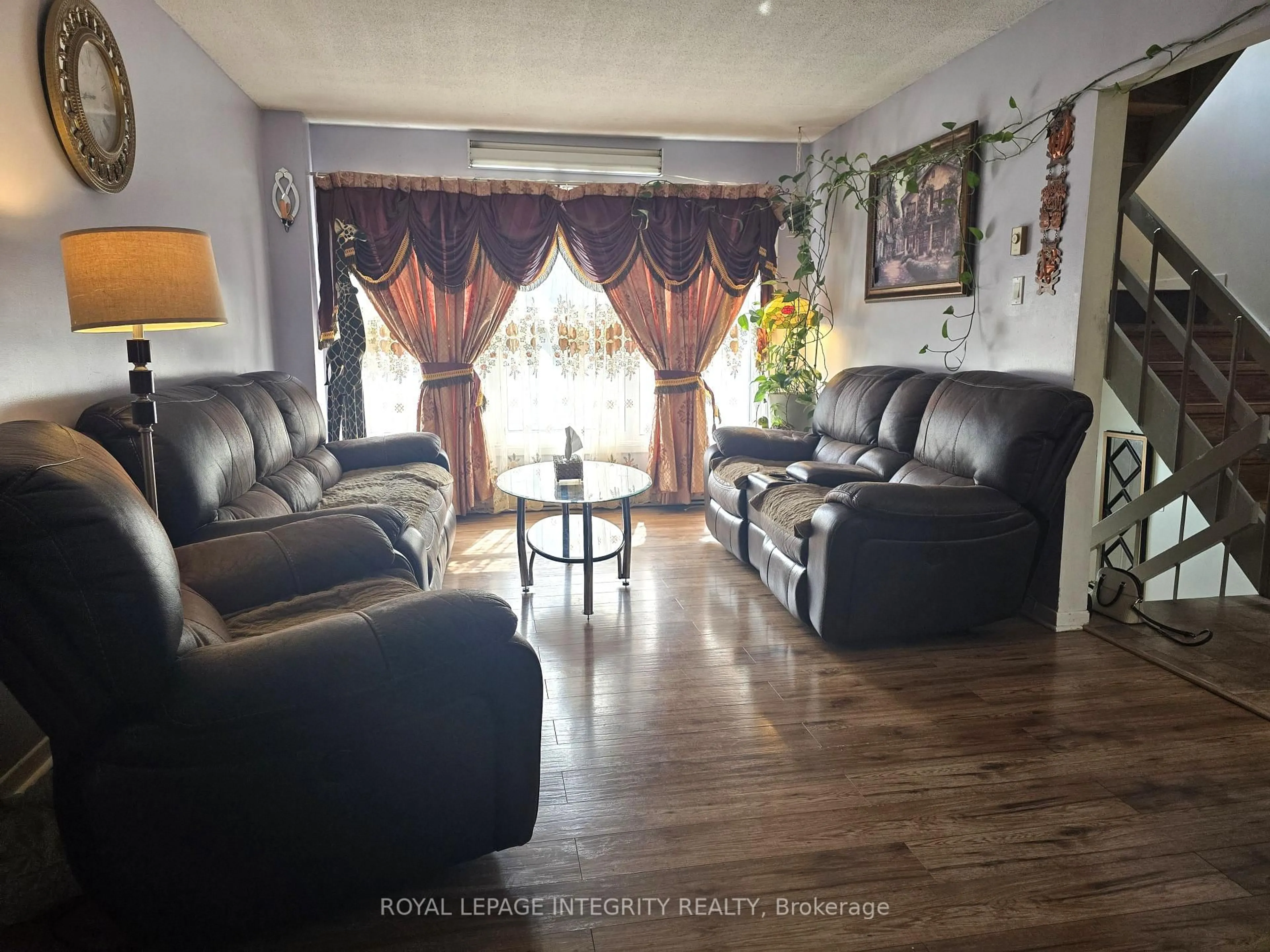 Living room with furniture, wood/laminate floor for 758 Glengarry Blvd, Cornwall Ontario K6H 6E7