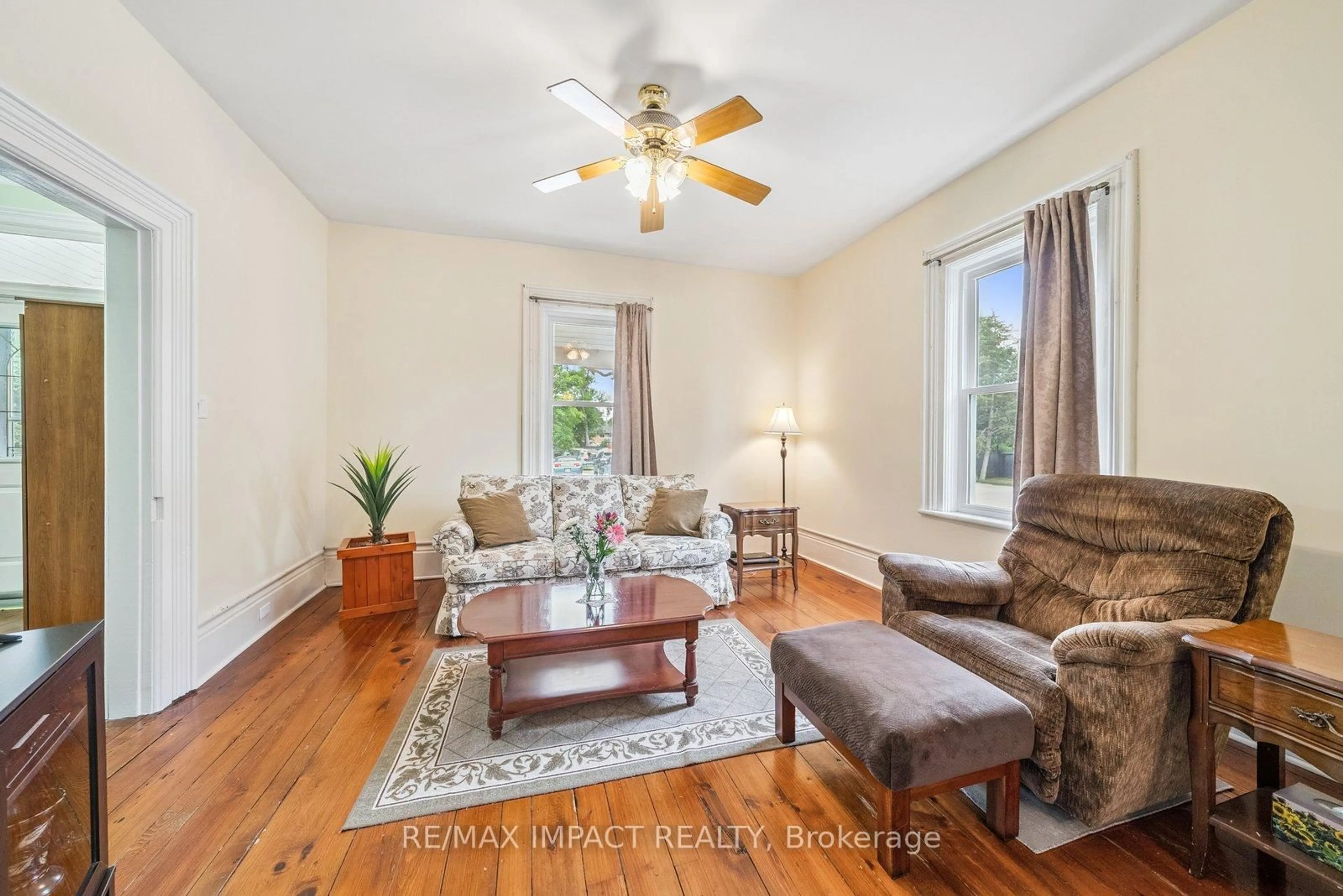 Living room with furniture, wood/laminate floor for 21 Centre Ave, Trent Hills Ontario K0L 1L0