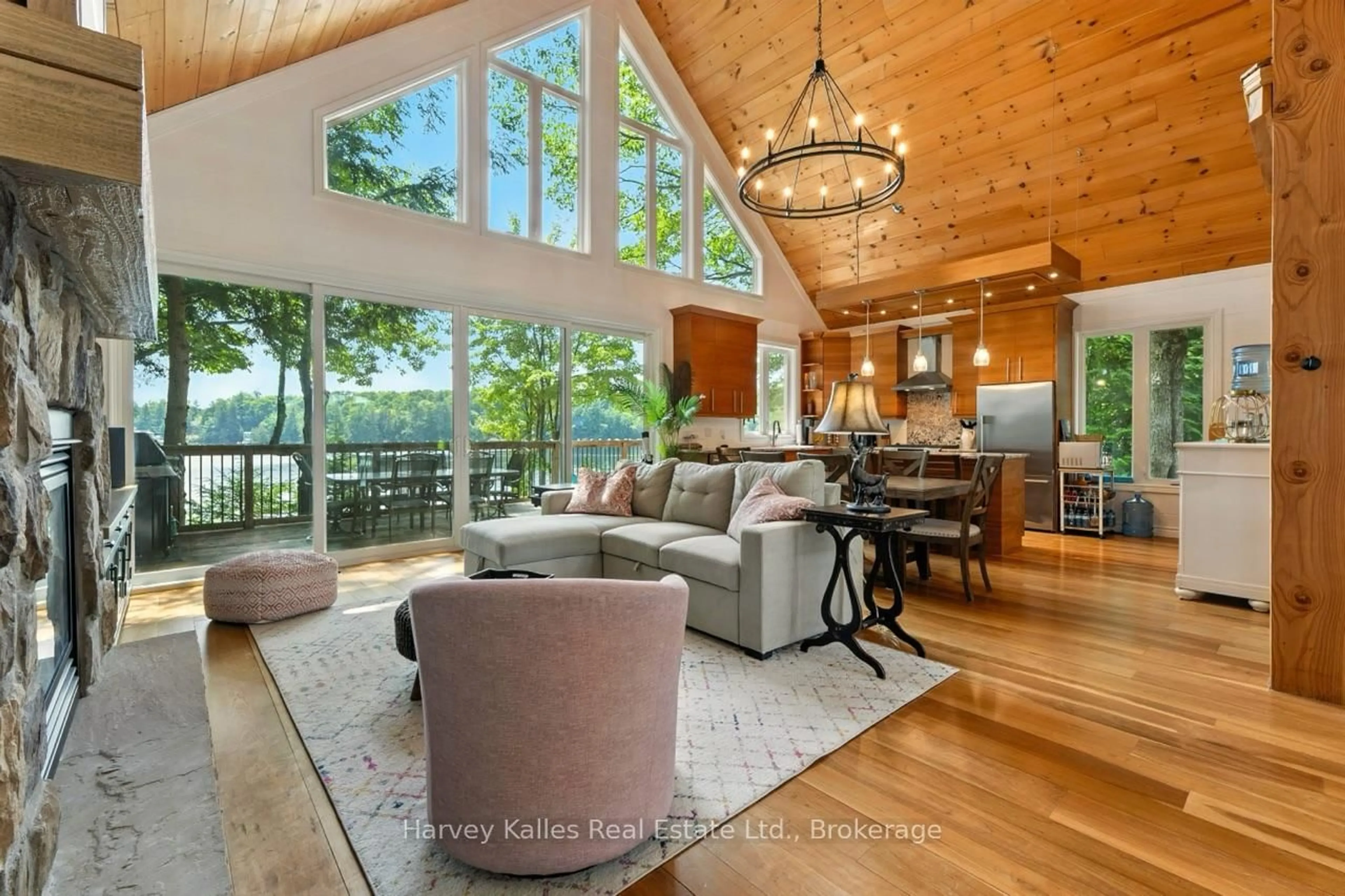 Living room with furniture, wood/laminate floor for 1082 Mortimers Point Rd, Muskoka Lakes Ontario P0B 1J0