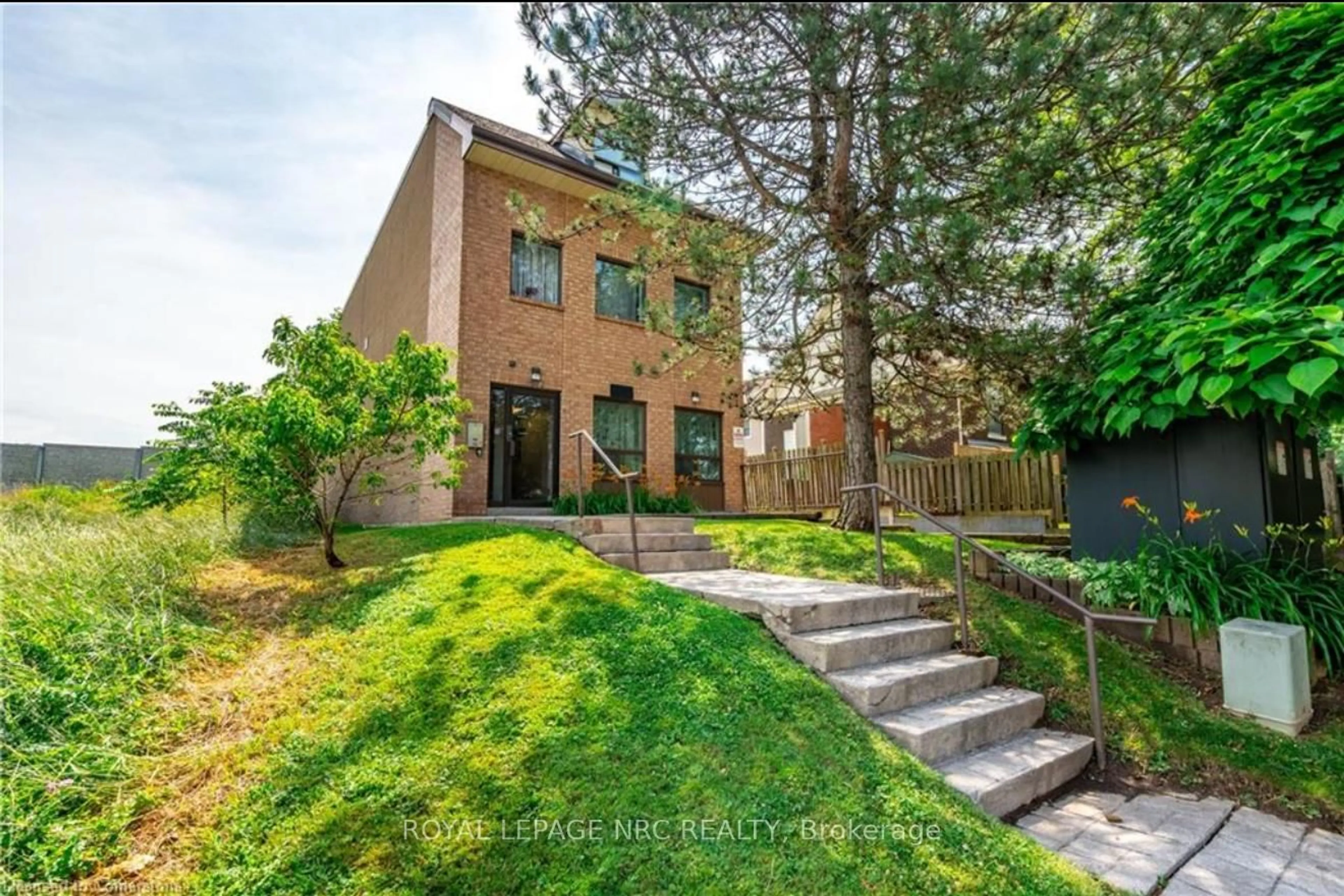 Home with brick exterior material, street for 4872 Valley Way #3, Niagara Falls Ontario L2E 1W3