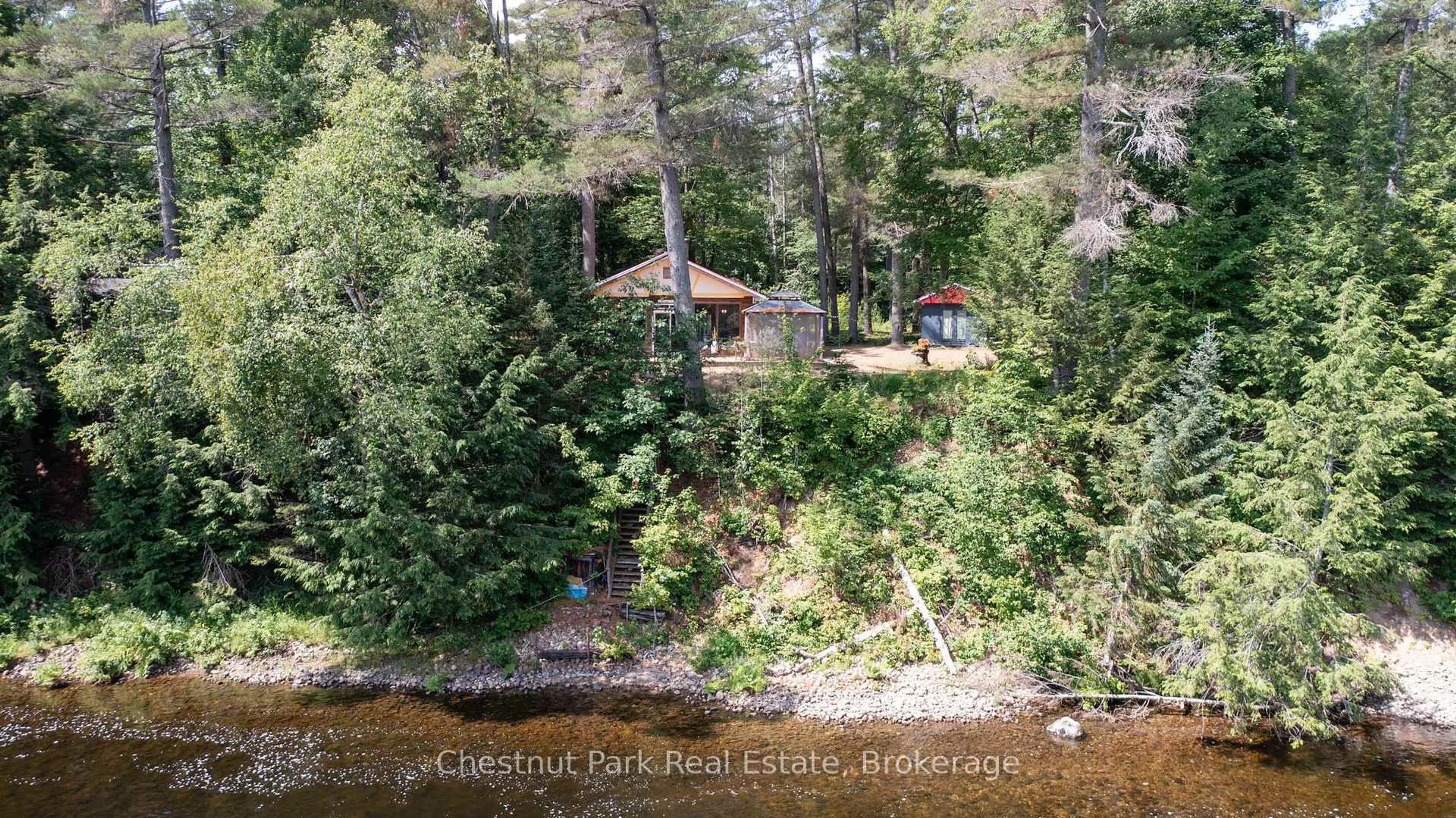 A pic from outside/outdoor area/front of a property/back of a property/a pic from drone, water/lake/river/ocean view for 1277 Sherwood Forest Rd, Bracebridge Ontario P1L 1X3