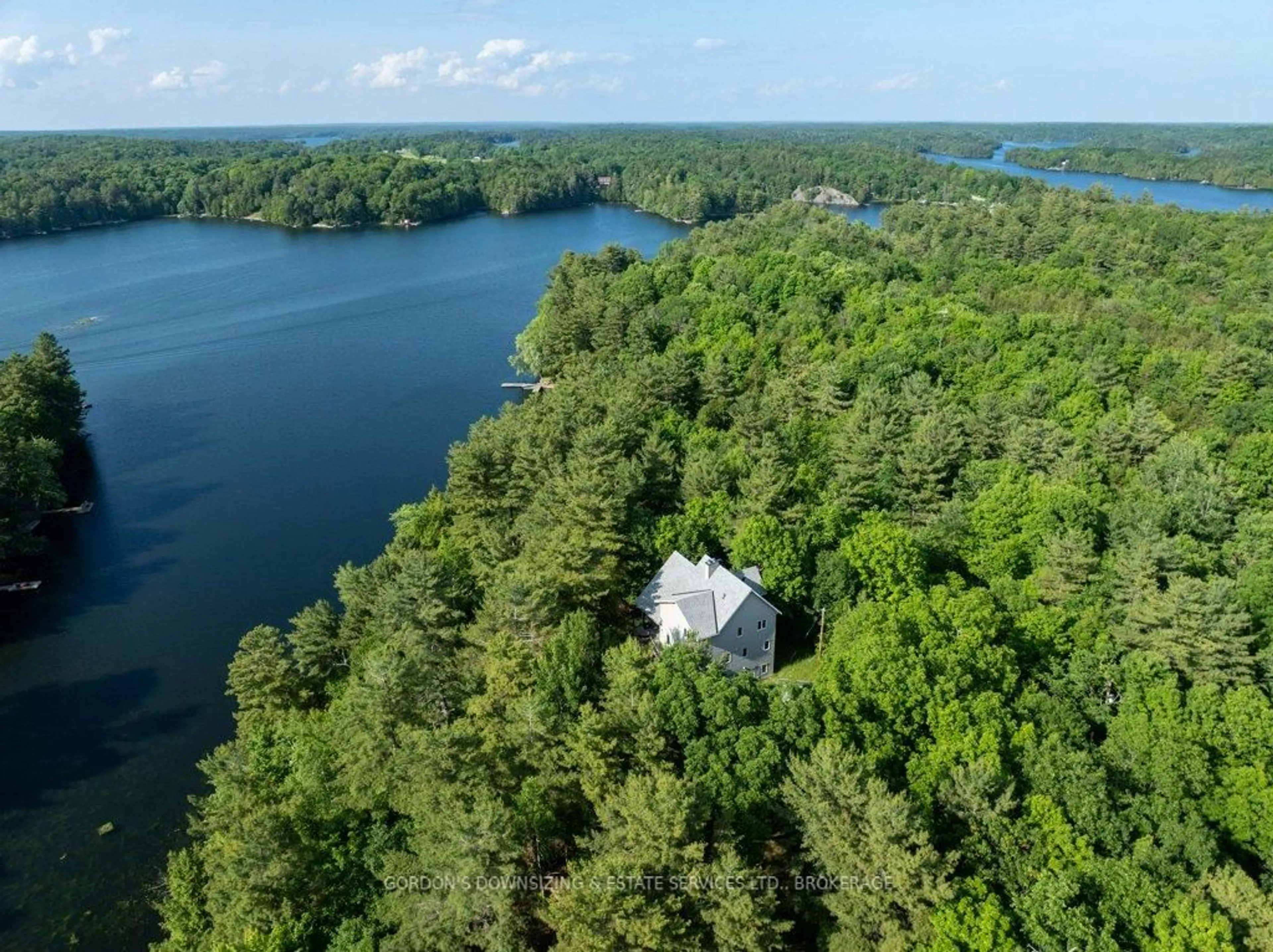 A pic from outside/outdoor area/front of a property/back of a property/a pic from drone, water/lake/river/ocean view for 1023 Neva Lane, Frontenac Ontario K9H 2L0