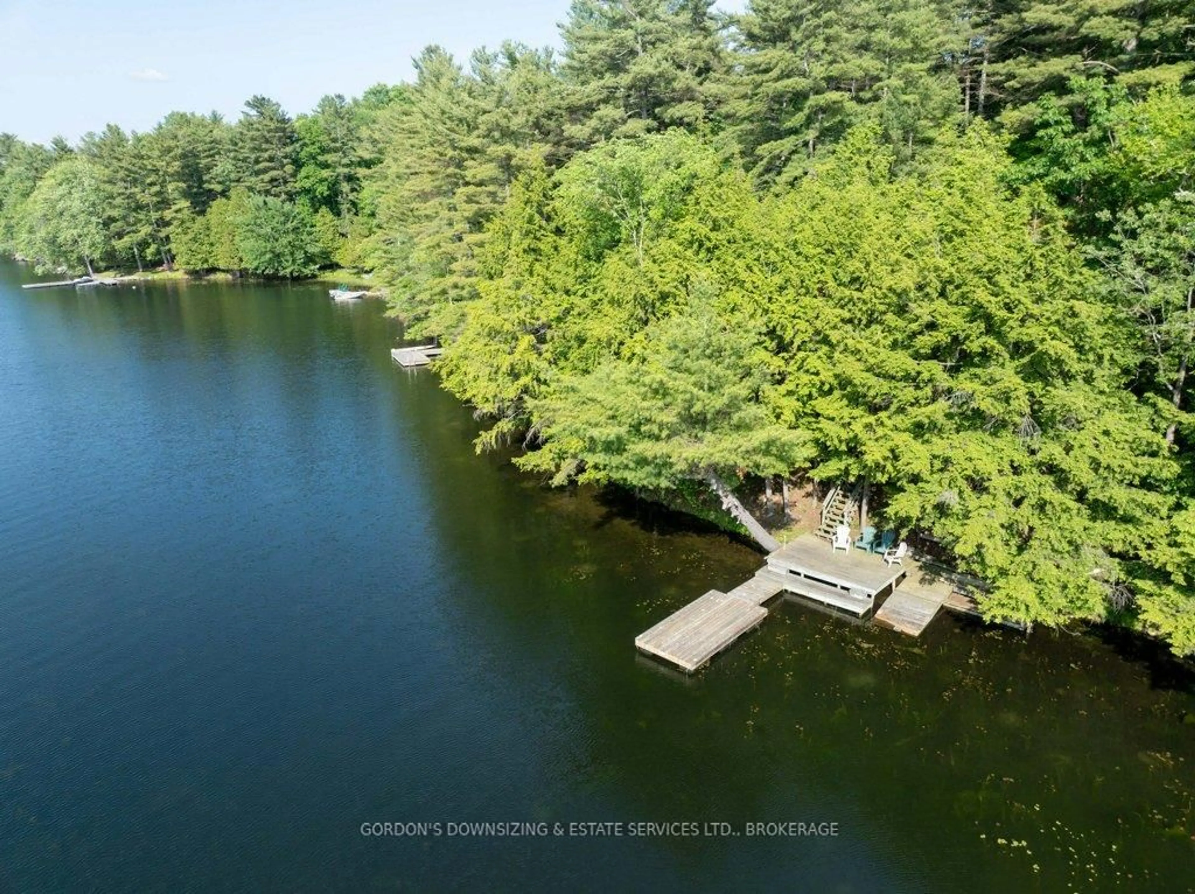 A pic from outside/outdoor area/front of a property/back of a property/a pic from drone, water/lake/river/ocean view for 1023 Neva Lane, Frontenac Ontario K9H 2L0