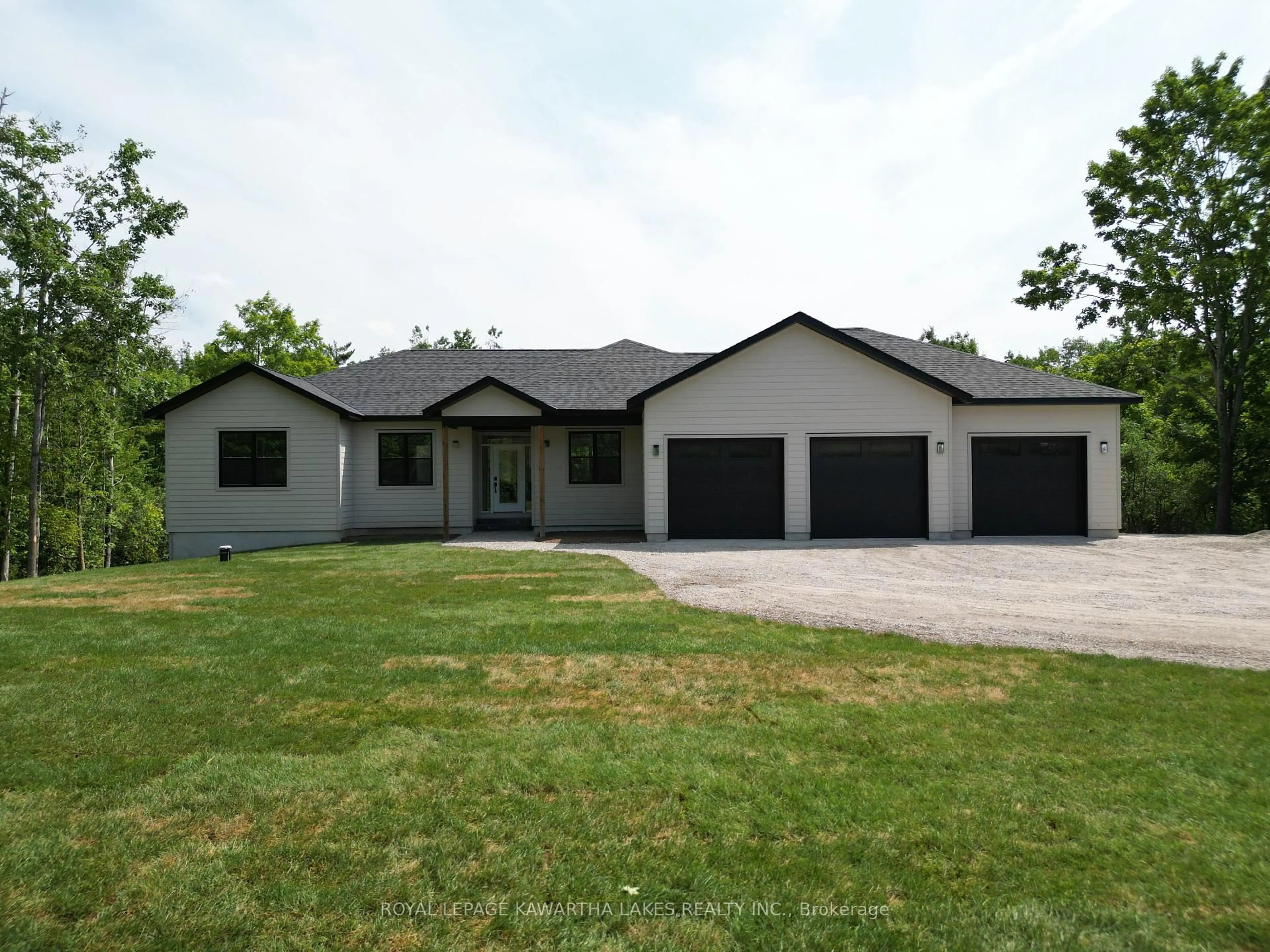 Home with vinyl exterior material, street for 104 Moon Line Rd, Kawartha Lakes Ontario K0M 1A0