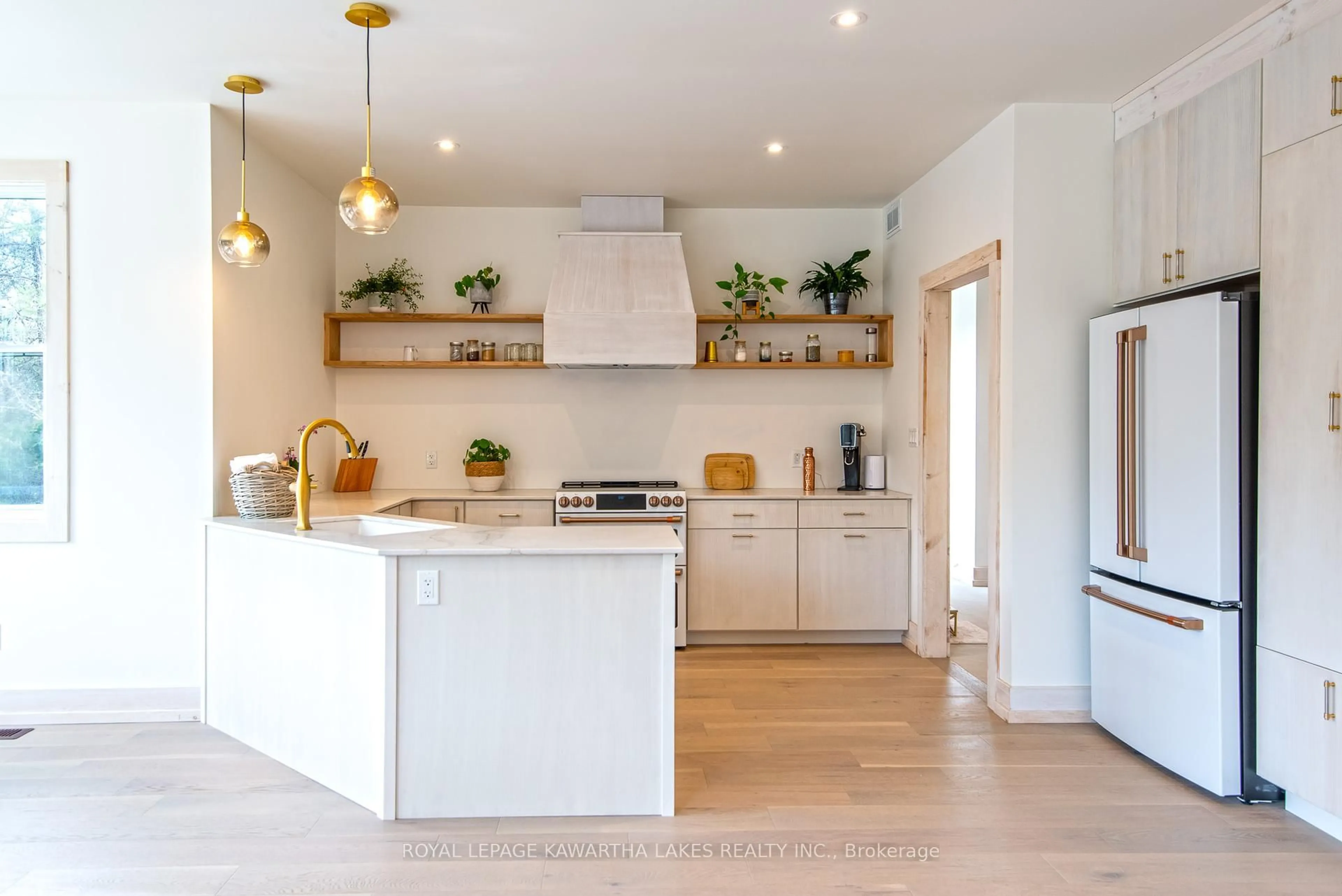 Open concept kitchen, wood/laminate floor for 104 Moon Line Rd, Kawartha Lakes Ontario K0M 1A0
