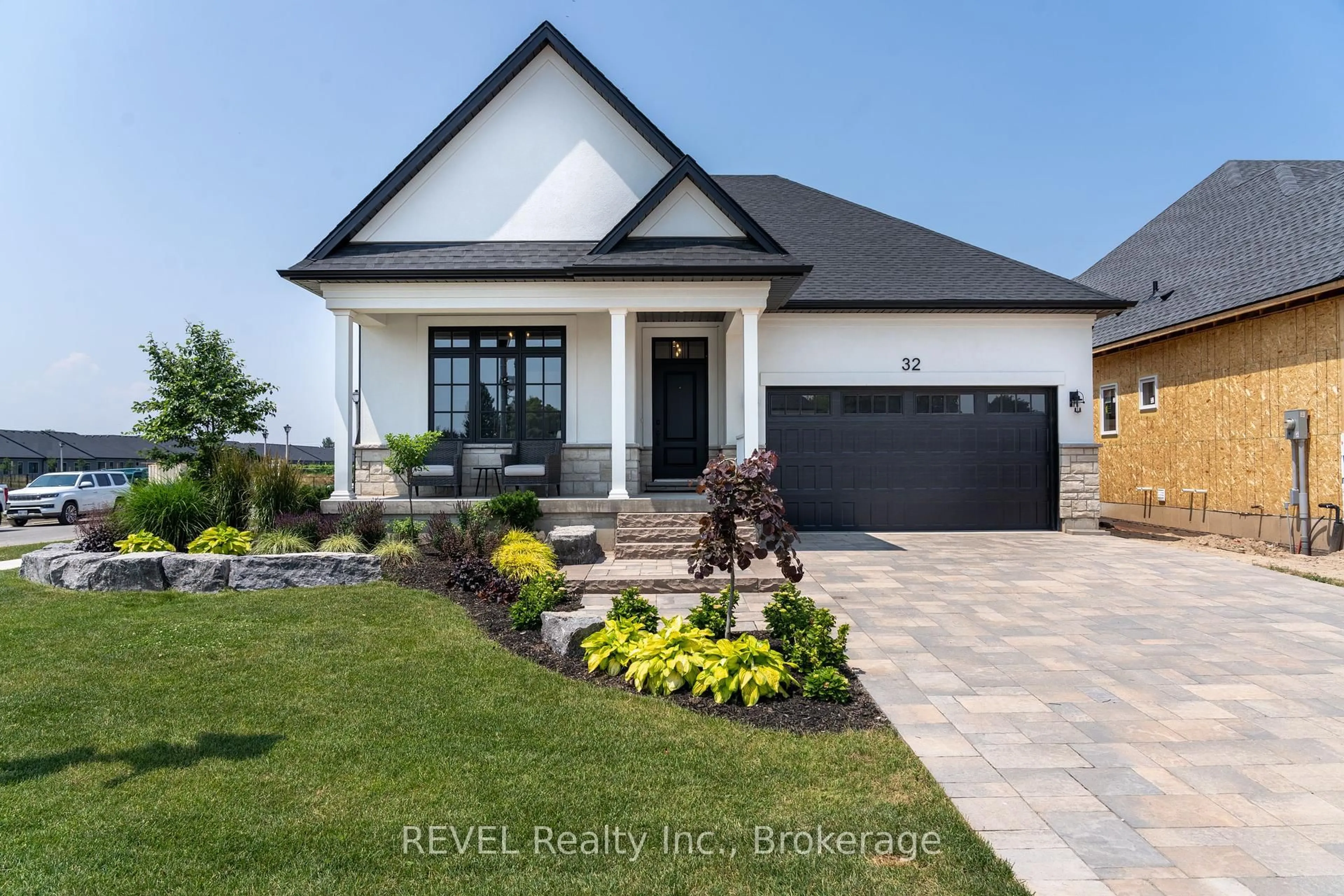 Home with brick exterior material, street for 32 Harvest Dr, Niagara-on-the-Lake Ontario L0S 1J0
