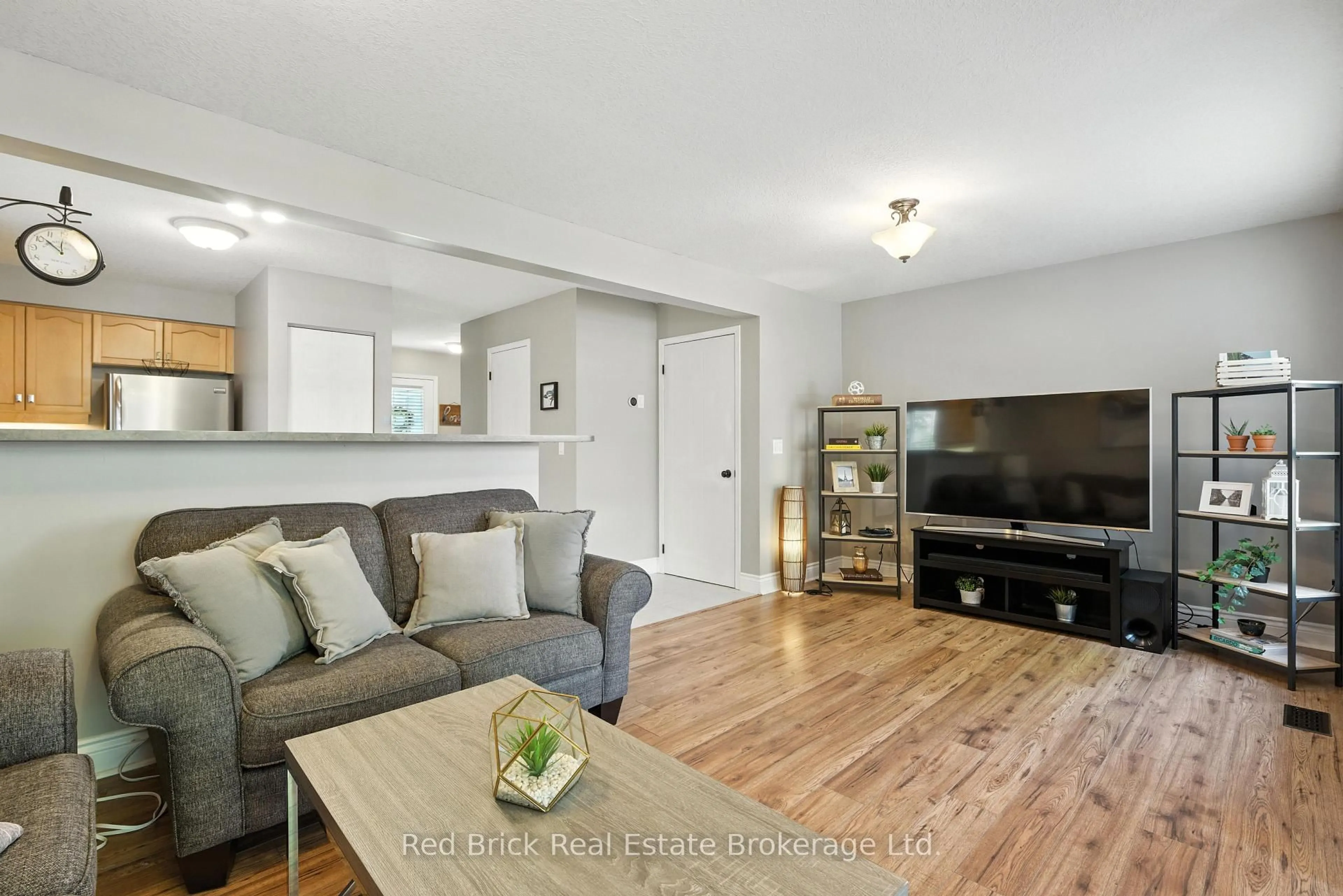 Living room with furniture, wood/laminate floor for 18 Boulder Cres, Guelph Ontario N1G 5A2