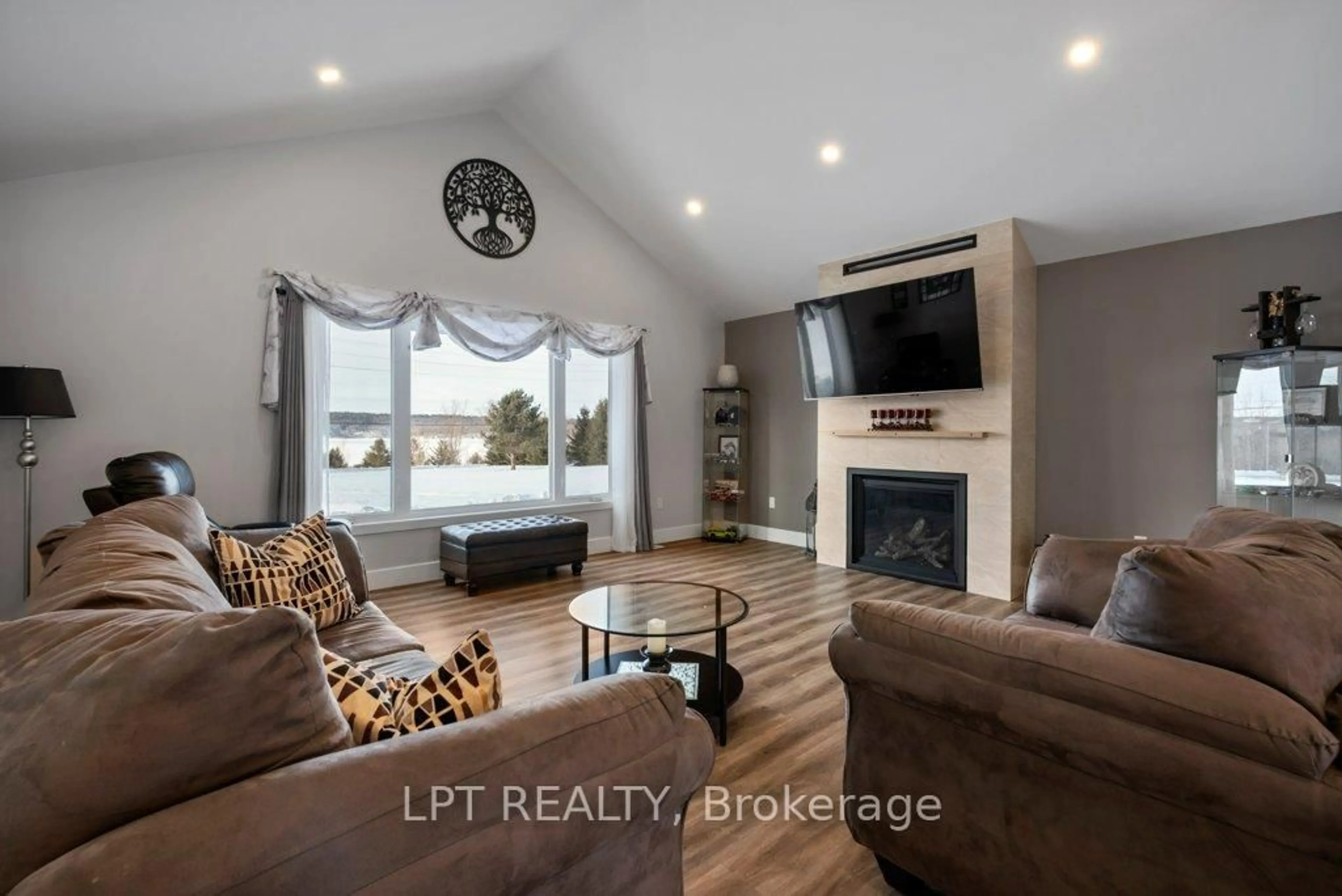 Living room with furniture, wood/laminate floor for 9517 County Road 42 Rd, Rideau Lakes Ontario K0G 1X0