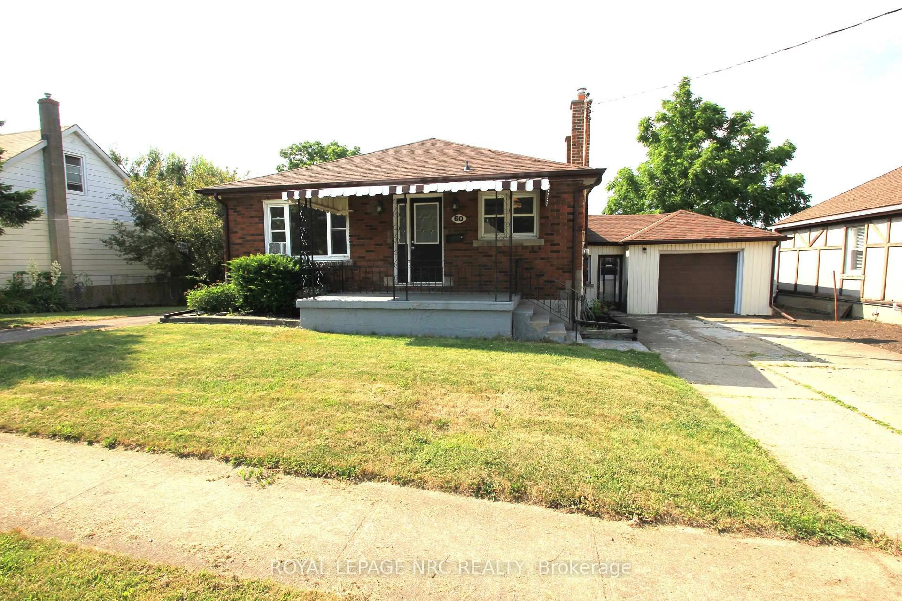 Home with brick exterior material, street for 60 Michael Ave, St. Catharines Ontario L2T 1S3