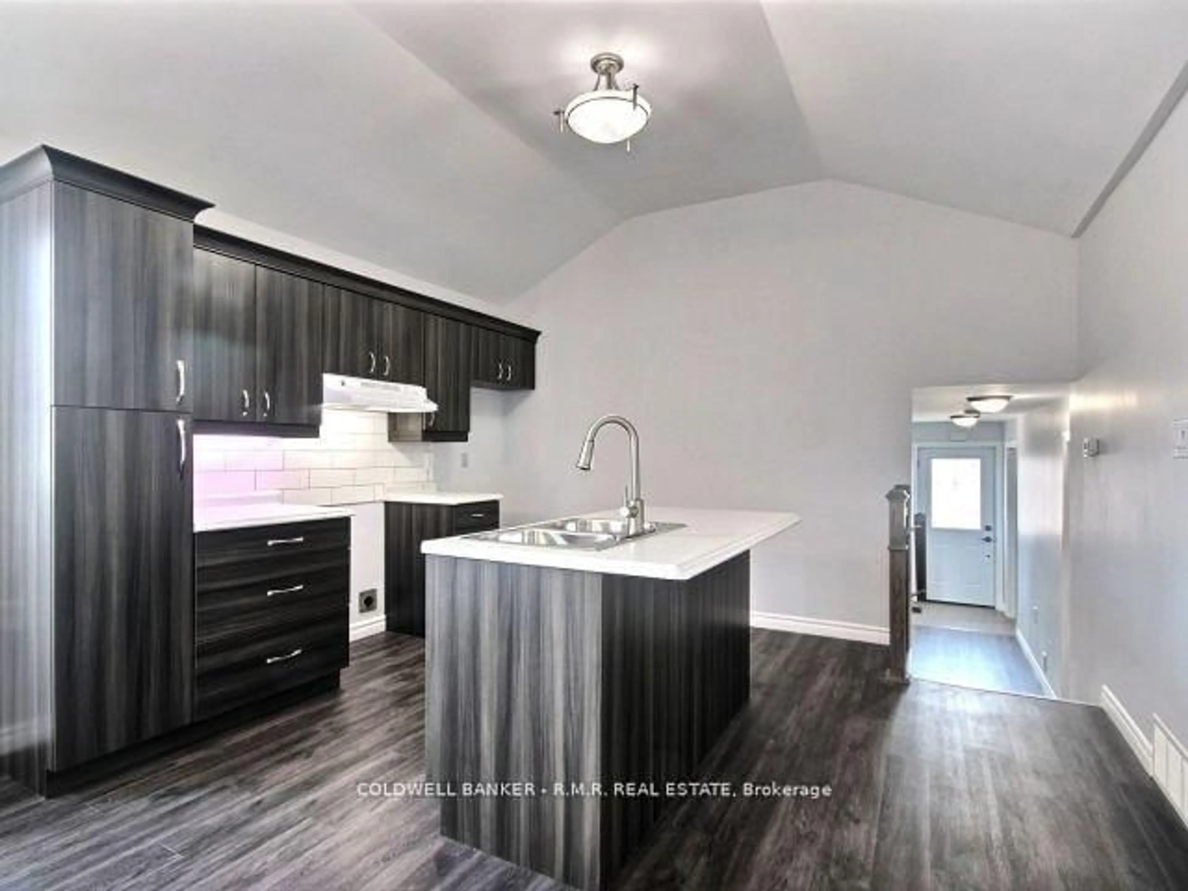 Open concept kitchen, wood/laminate floor for 394 Ontario St, Cobourg Ontario K9A 3B8
