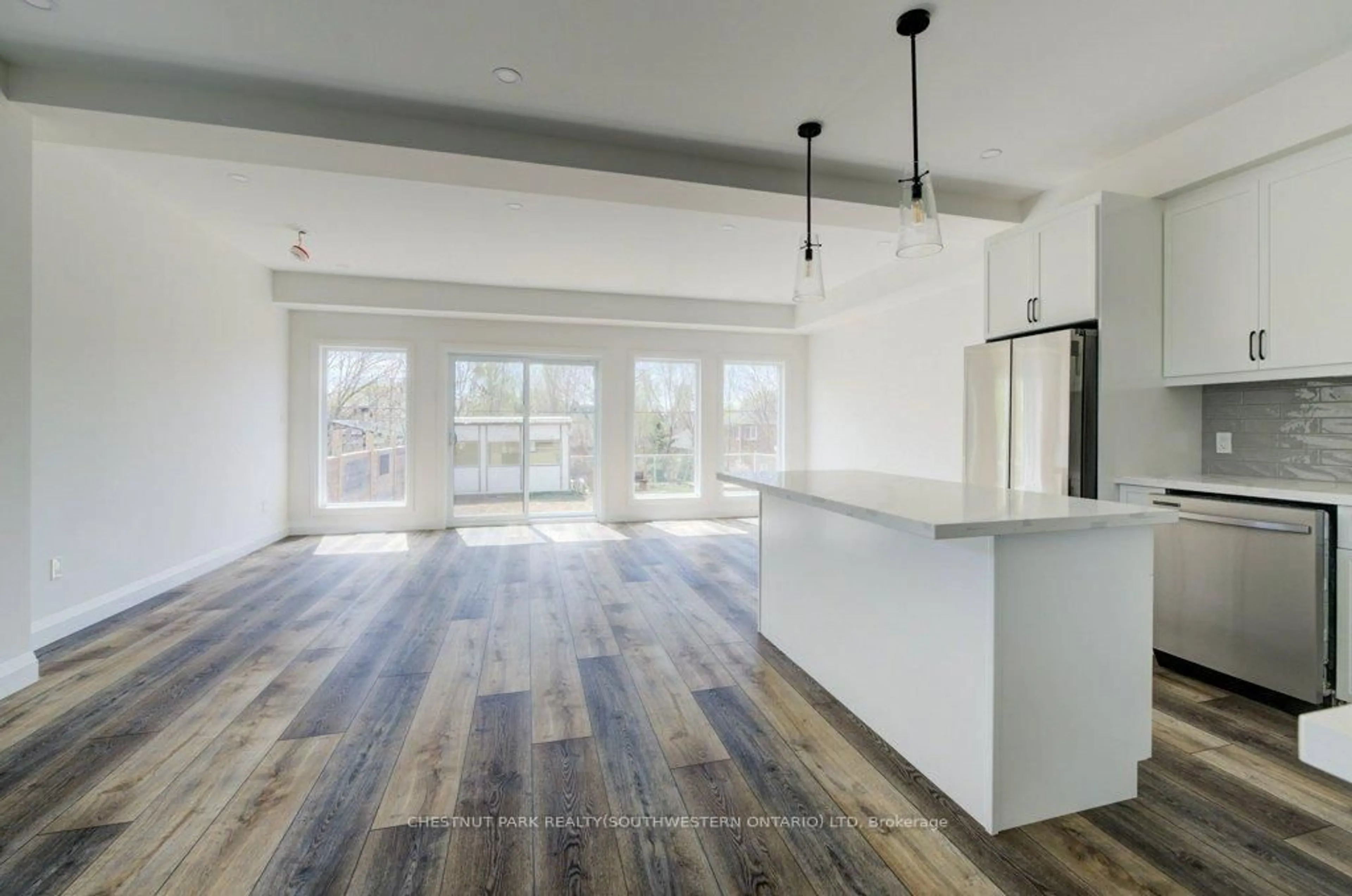 Open concept kitchen, wood/laminate floor for 575 Guelph St, Kitchener Ontario N2H 5Y2