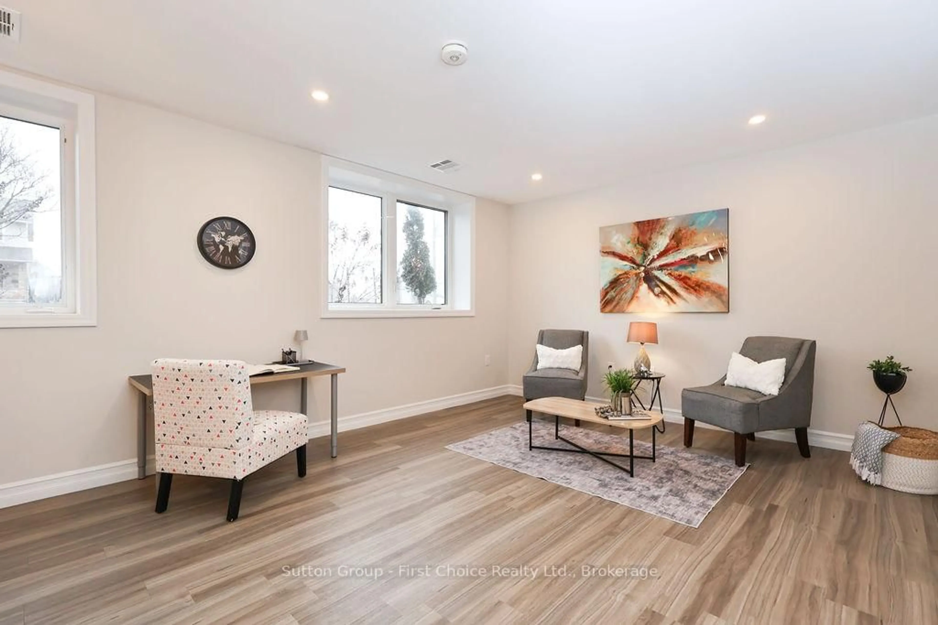 Living room with furniture, wood/laminate floor for 100 GORDON St #101, Stratford Ontario N5A 7T8