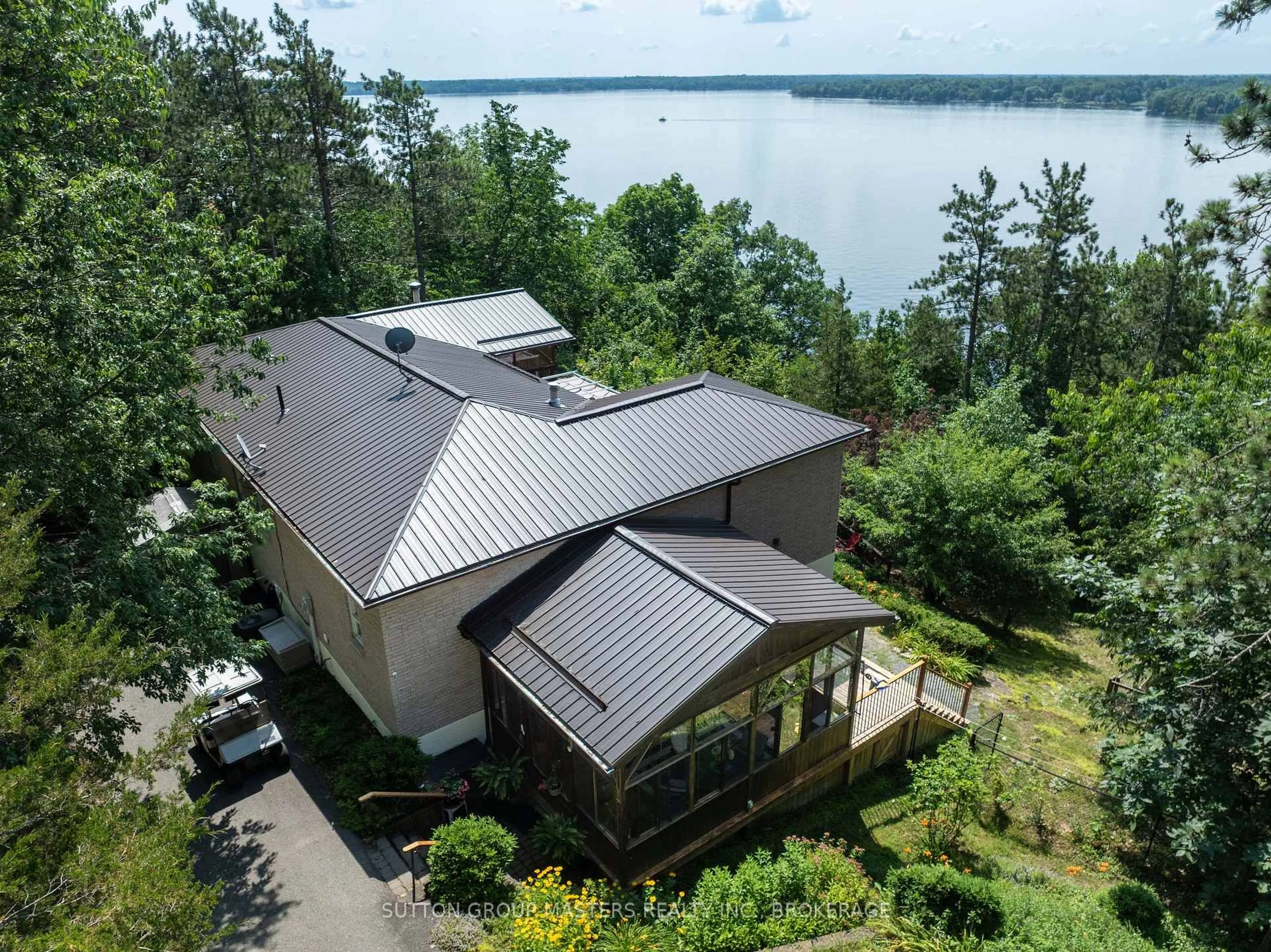 A pic from outside/outdoor area/front of a property/back of a property/a pic from drone, water/lake/river/ocean view for 715 North Shore Rd, Rideau Lakes Ontario K0G 1X0