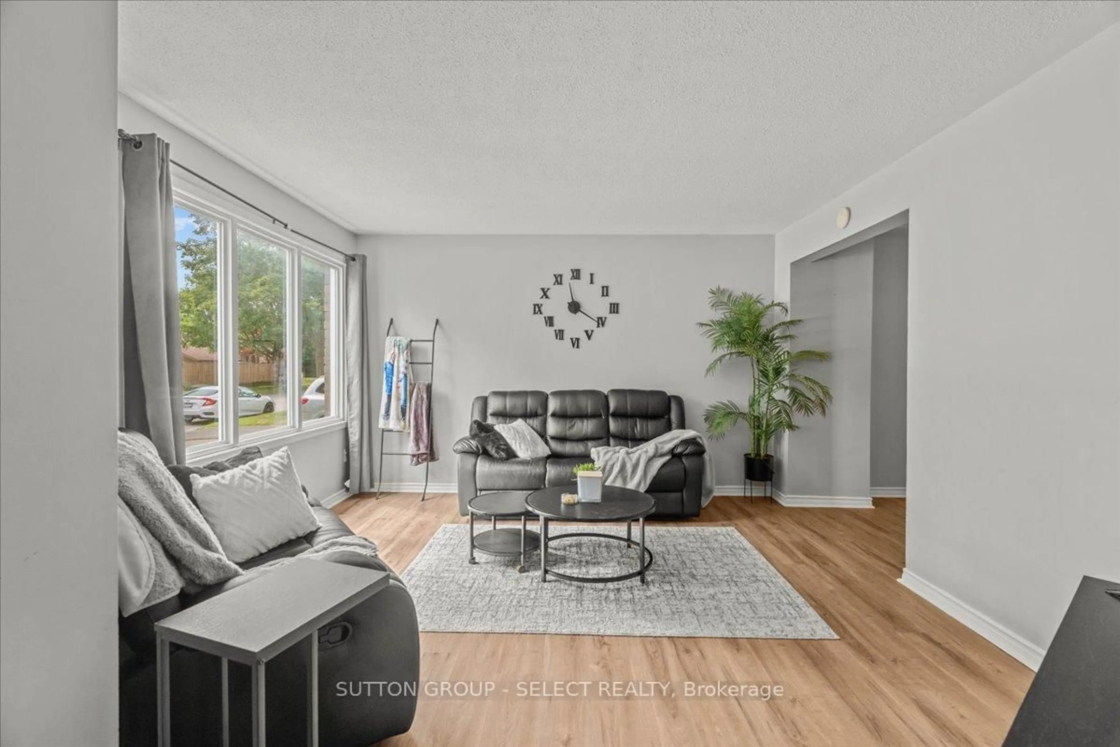 Living room with furniture, wood/laminate floor for 1777 Aldersbrook Rd, London North Ontario N6G 3E2