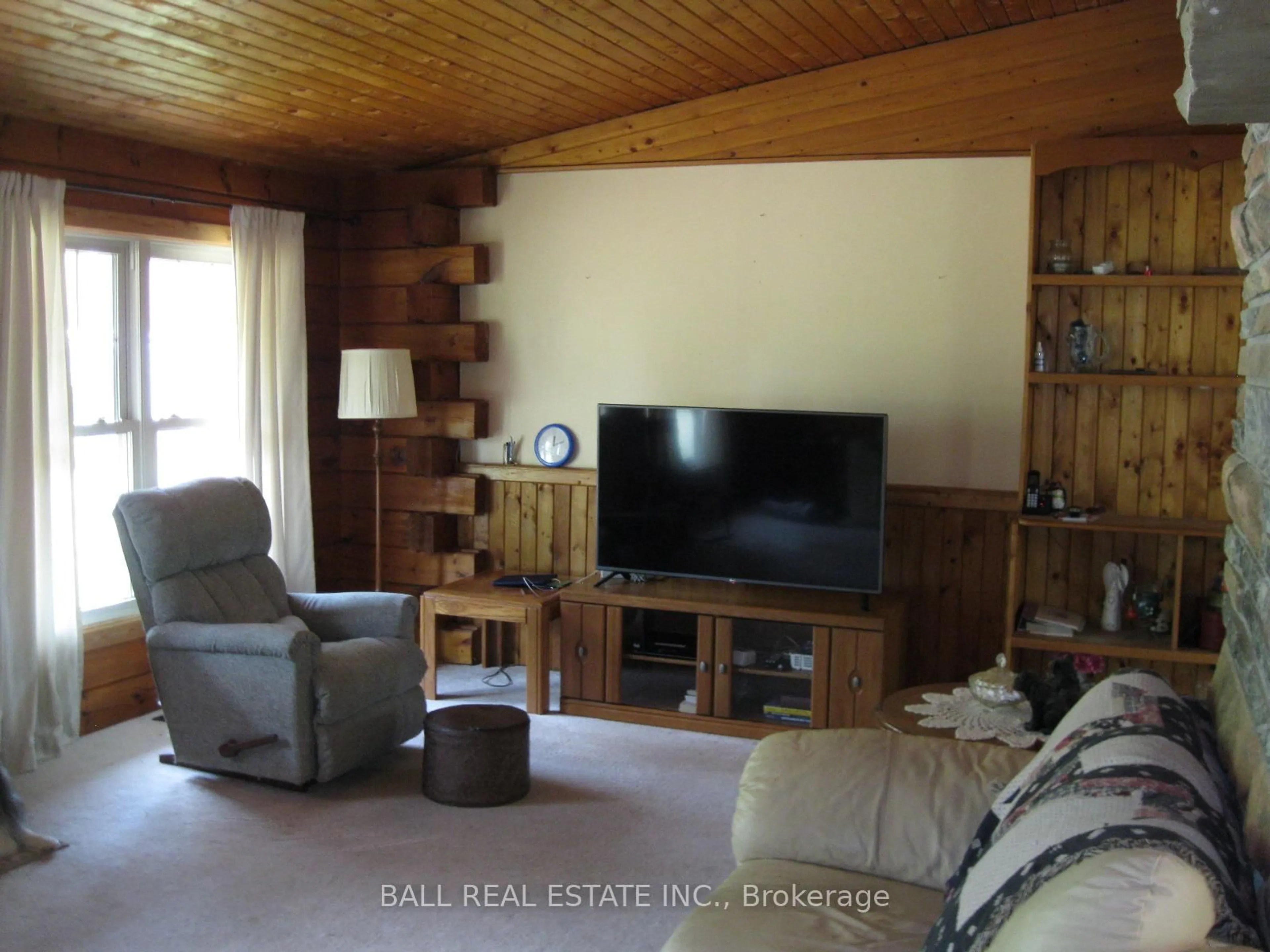 Living room with furniture, wood/laminate floor for 895 Crowe River Rd, Trent Hills Ontario K0K 2M0