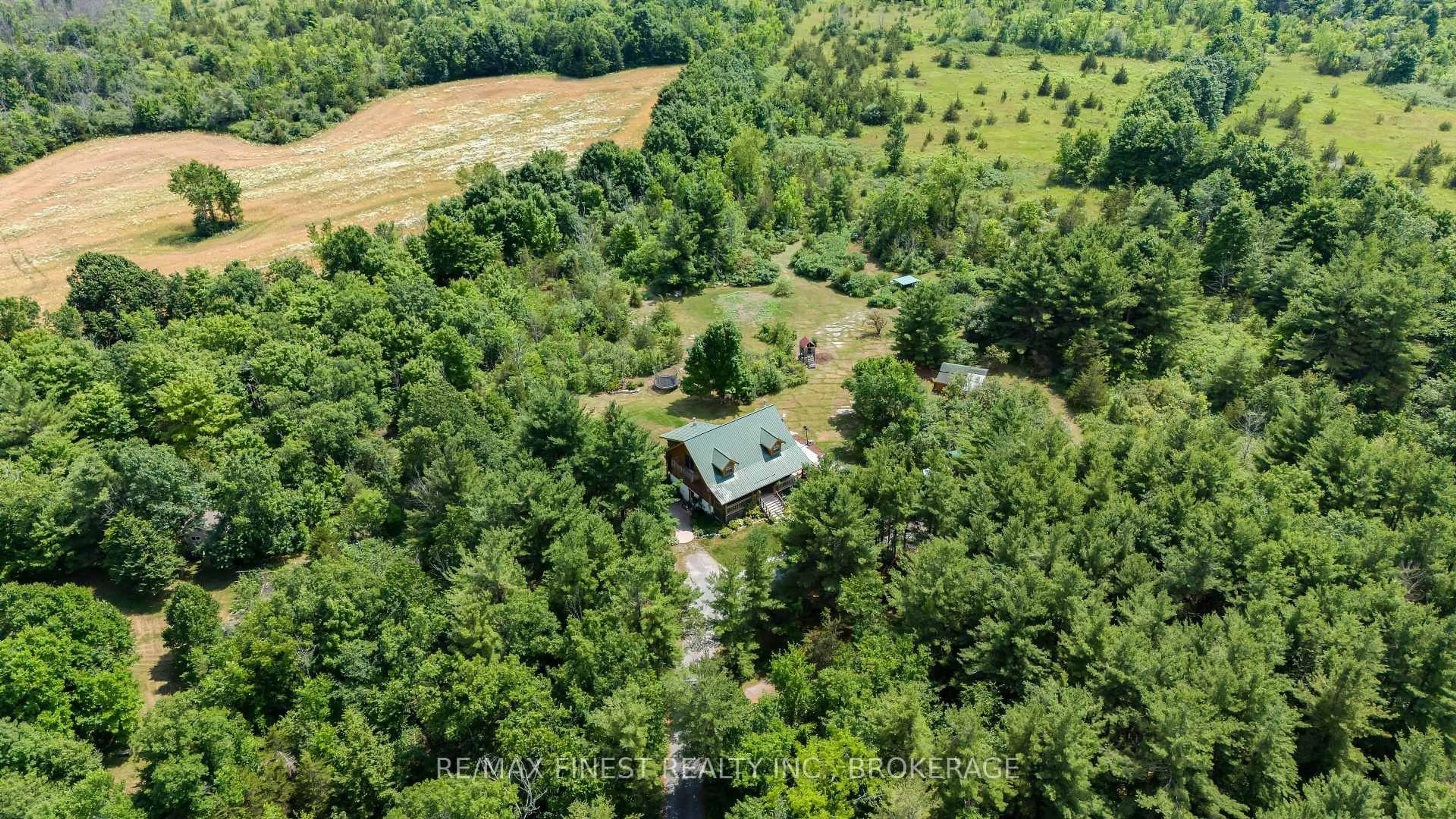 A pic from outside/outdoor area/front of a property/back of a property/a pic from drone, forest/trees view for 5006 Wallace Rd, Harrowsmith Ontario K0H 1V0